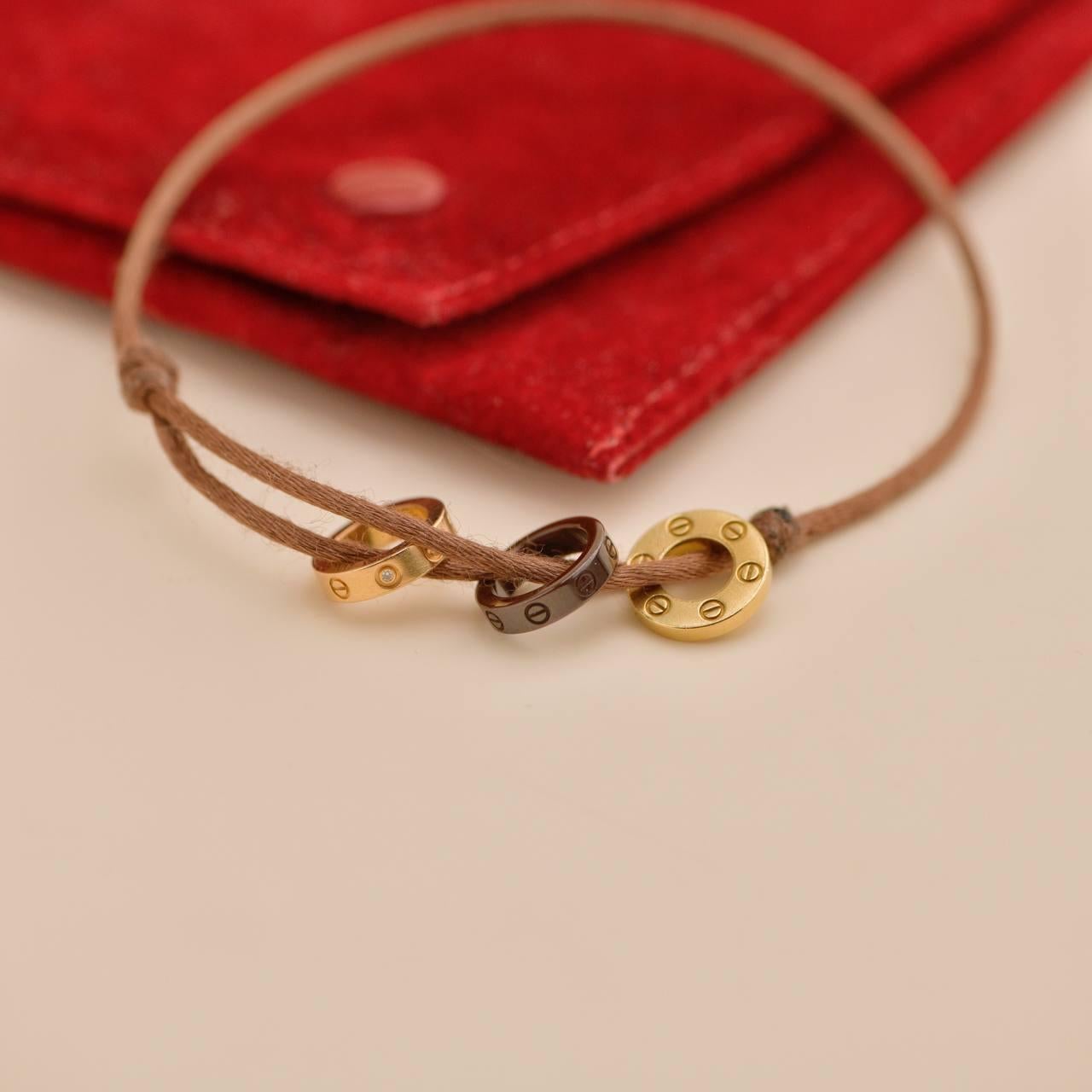 Women's or Men's Cartier Love 18k Yellow & Rose 4 Diamond Sèvres Porcelain Brown Cord Bracelet For Sale