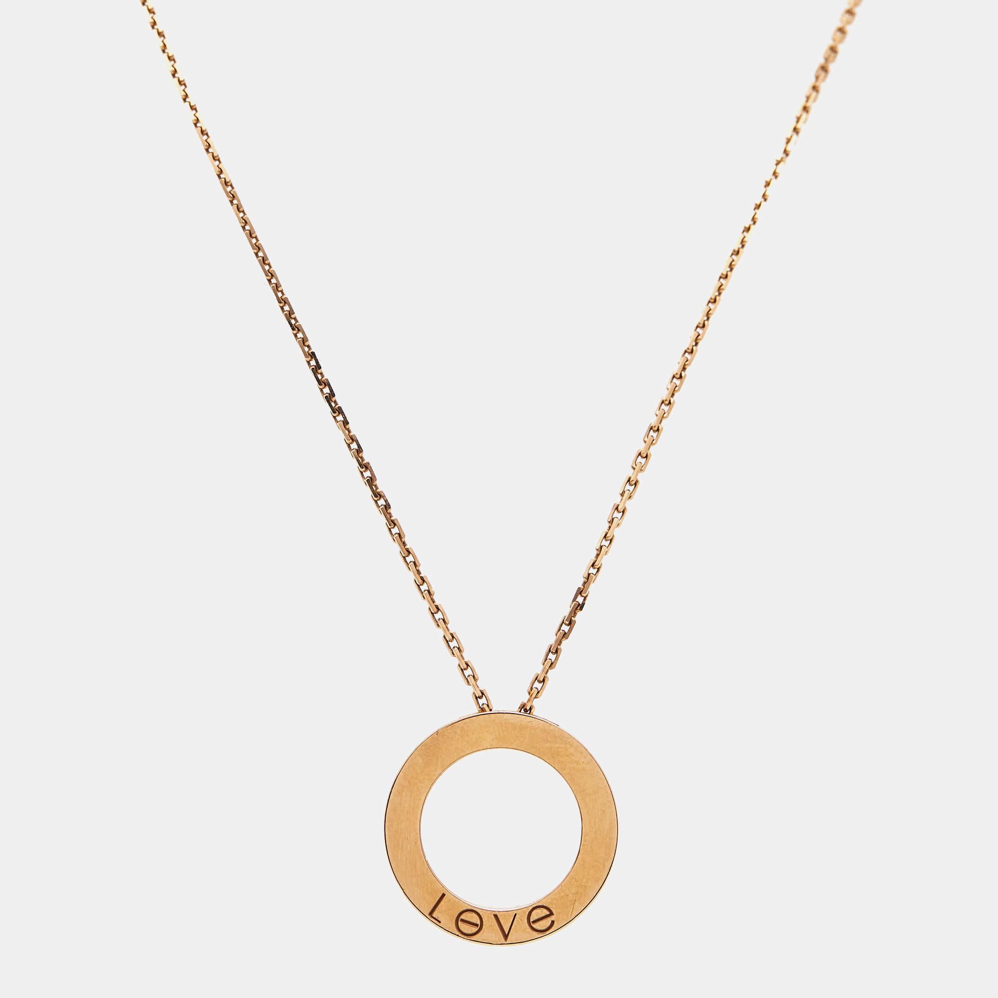 This radiant Love necklace from Cartier is not only beautiful to look at but also a timeless piece that will be cherished for years to come! It has been crafted from 18K rose gold and features a chain-link carrying a ring pendant detailed with three
