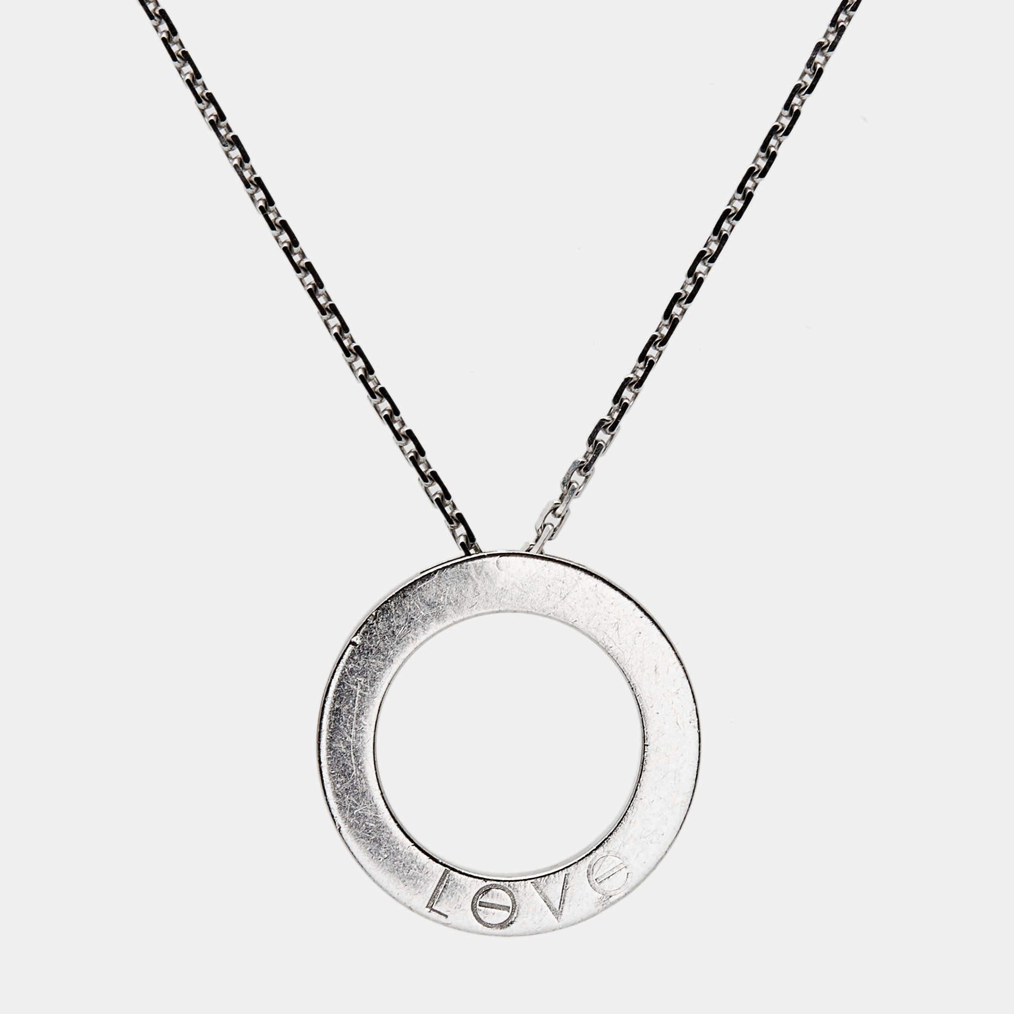 This radiant Love necklace from Cartier is not only beautiful to look at but also a timeless piece that will be cherished for years to come! It has been crafted from 18K white gold and features a chain-link carrying a ring pendant that is detailed