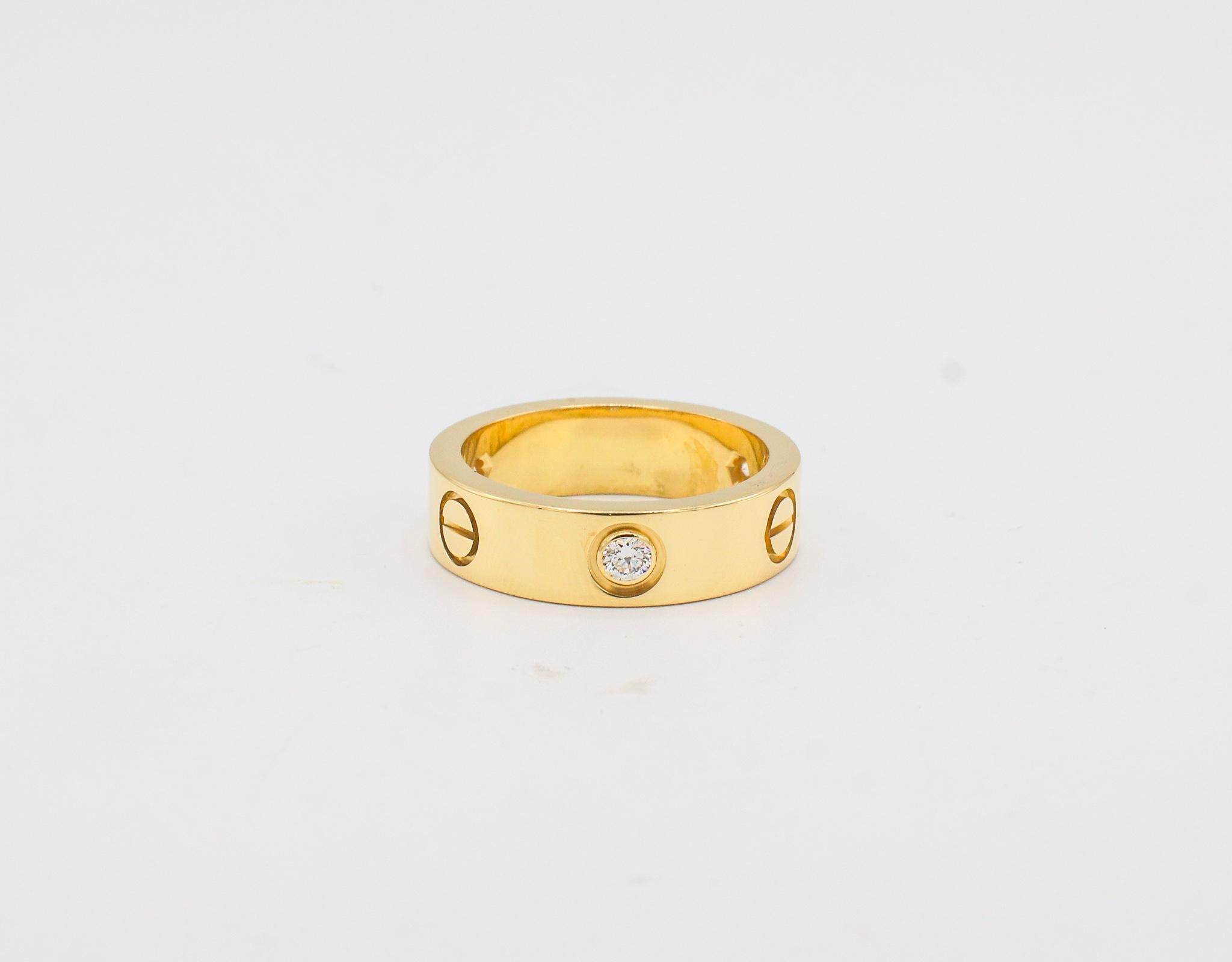 Cartier LOVE 3 Diamond Yellow Gold Band Ring 
Metal: 18k yellow gold
Weight: 8.83 grams
Size: 53 (6.25 US)
Width: 5.5mm
Diamonds: 3 round diamonds .22 CTW G VS
Retail: $3,850 USD
Notes: Box & Papers