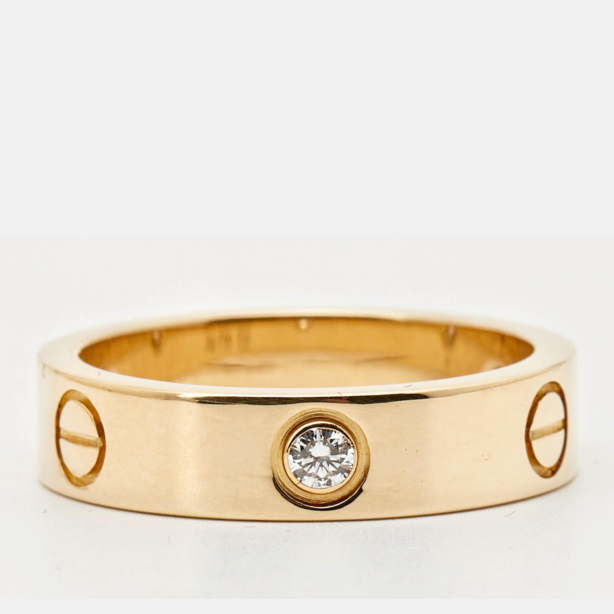 The Cartier Love ring in 18k yellow gold is an iconic symbol of everlasting commitment. Adorned with three brilliant cut diamonds and Cartier's signature screw motif it's a classic piece thats perfect for everyday wear or special occasions.
