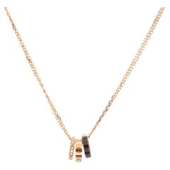 Cartier, collier pendentif Love 3 anneaux en or rose 18 carats et céramique avec diamants