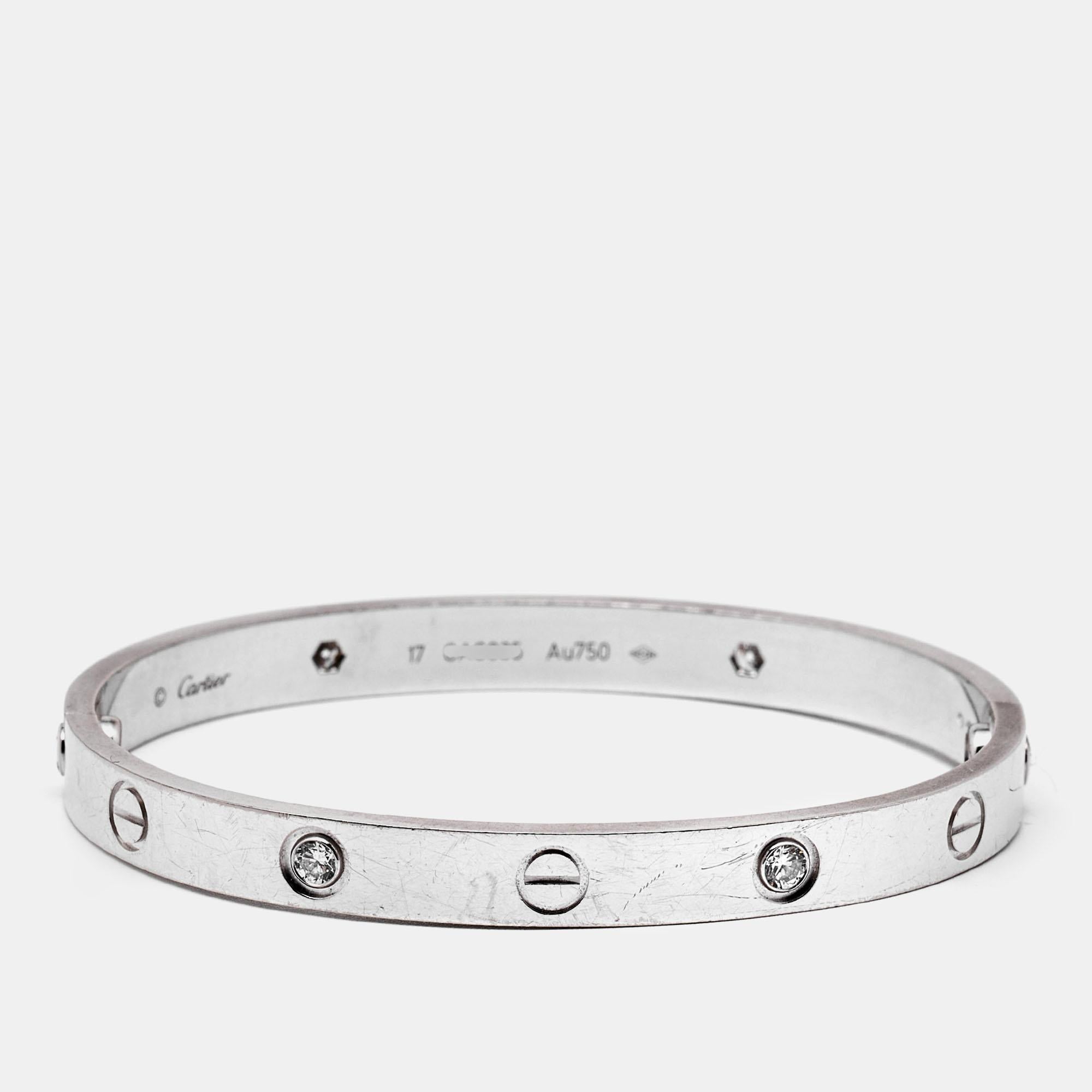 Cartier's Love bracelet is a modern symbol of luxury and a way to lock in one's love. Designed in an oval shape to comfortably sit around your wrist, the iconic piece is laid with distinct screw motifs and secured by a screw closure. This beauty