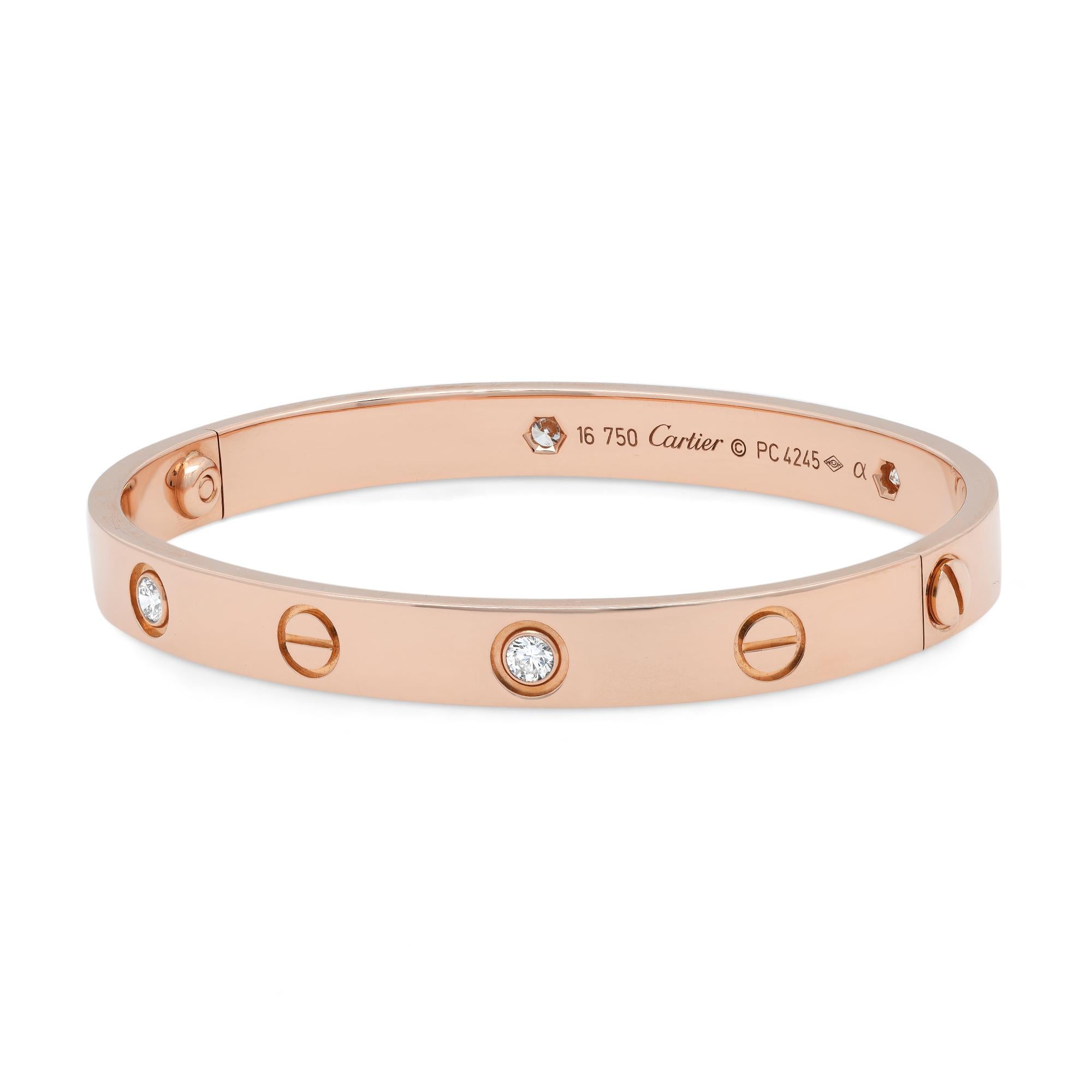 Cartier LOVE bracelet crafted in 18K rose gold, set with 4 round brilliant cut diamonds weighing 0.42 carats. A close fitting, oval bracelet composed of two rigid arcs which are worn on the wrist and removed using a specific screwdriver. Old style