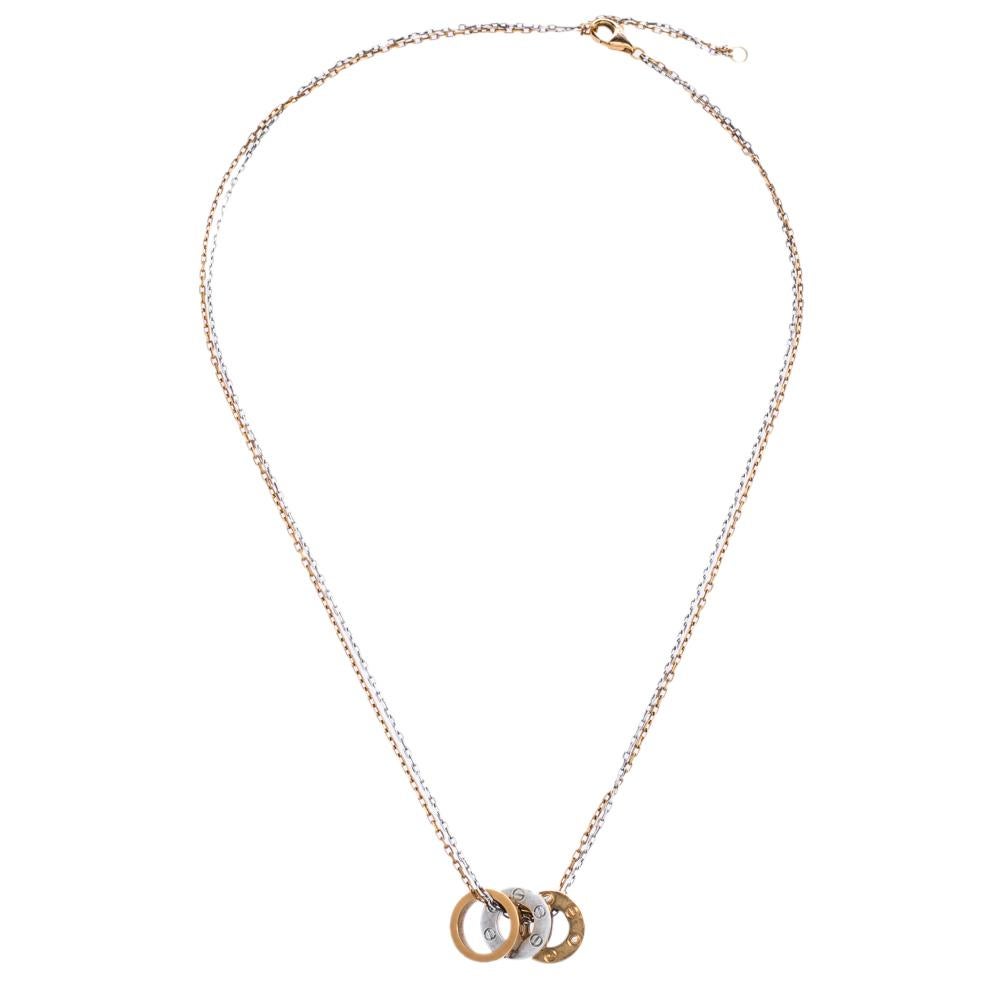 Nothing can be as romantic as this stunning necklace by Cartier. Crafted in 18K white gold and rose gold, it looks splendid with three circular charms. They are detailed with round brilliant-cut diamonds and the iconic screw motifs. From the popular