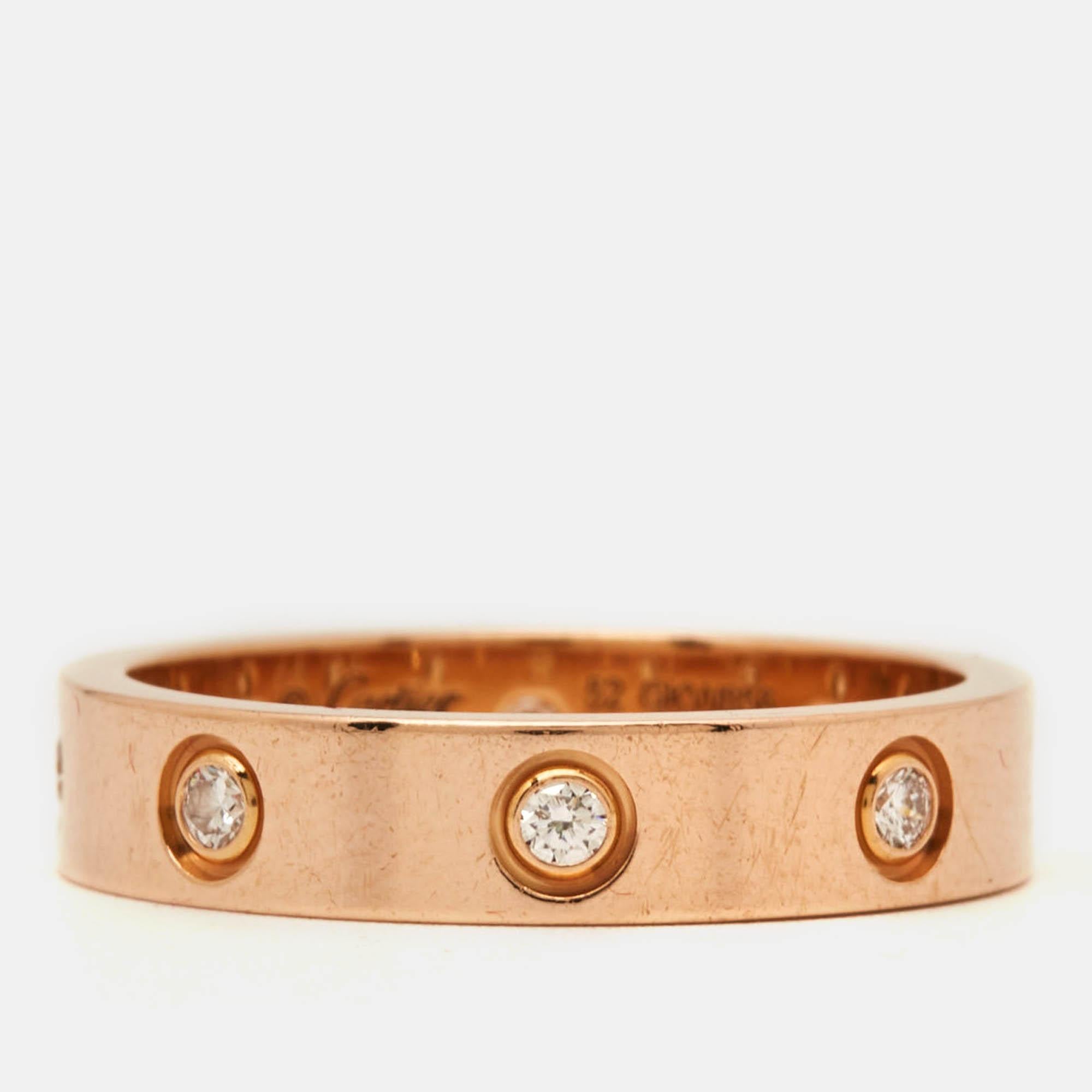 Crafted with meticulous attention to detail the Cartier Love ring exudes timeless beauty. Gleaming with elegance this exquisite piece features eight dazzling diamonds set in lustrous 18k rose gold. Each diamond sparkles with brilliance symbolizing