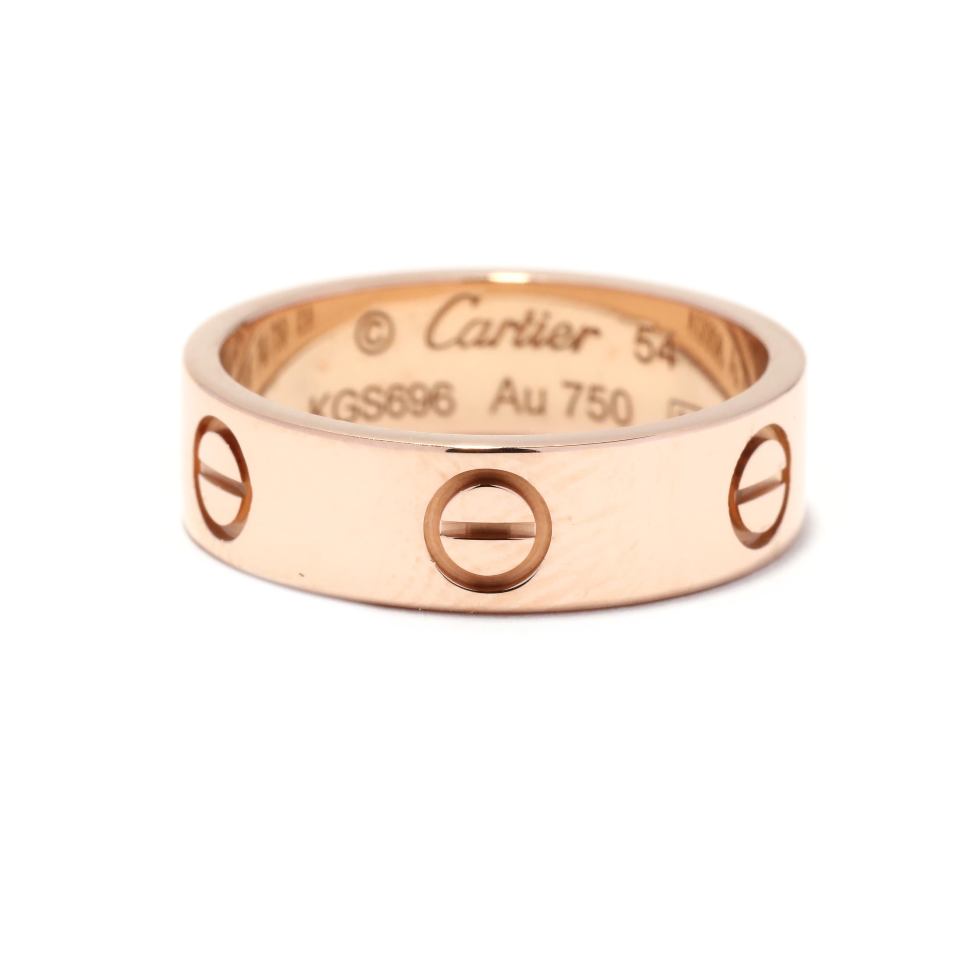 A vintage 18 karat gold wedding band design by Cartier for the 'Love' collection. This ring features an eternity design with screw top motifs. Please note that this ring is accompanied with the original Cartier box and bag.

Ring Size 6.75 US; 54