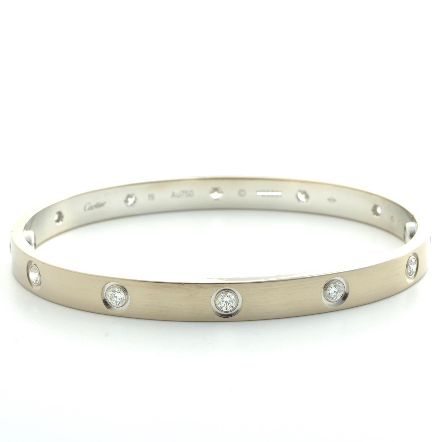 Designer: Cartier

Collection: Love

Style: 10 Diamond Bangle Bracelet

Metal: White Gold

​​​​​​​Metal Purity: 18k

Stone: Round Brilliant Cut Diamonds

Bracelet Size: 19 = 19 cm

Hallmarks: 18, Au750 Cartier, Serial No.,

Includes:  24 Months