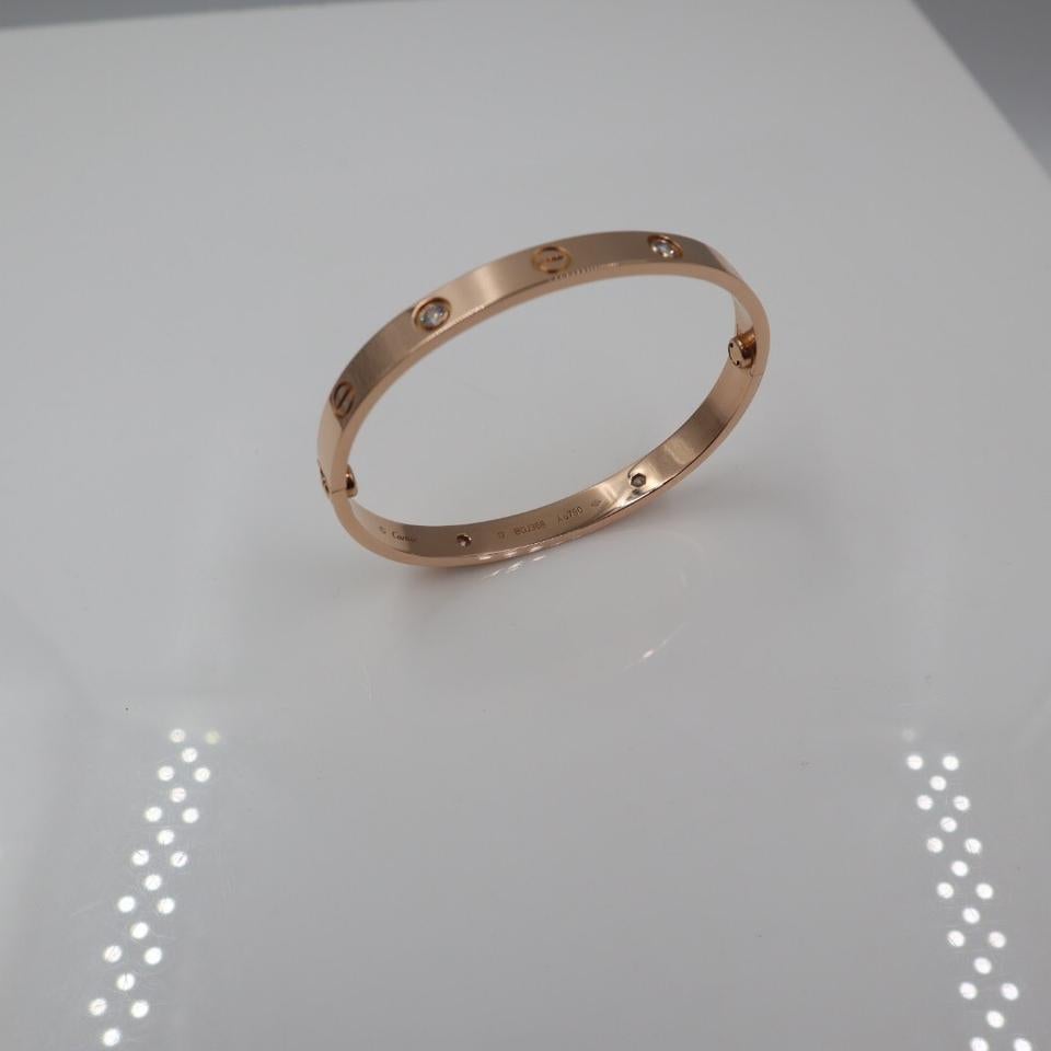 Genuine Cartier Bangle from Love collection. 
Four diamonds 0.42cts Size 17.