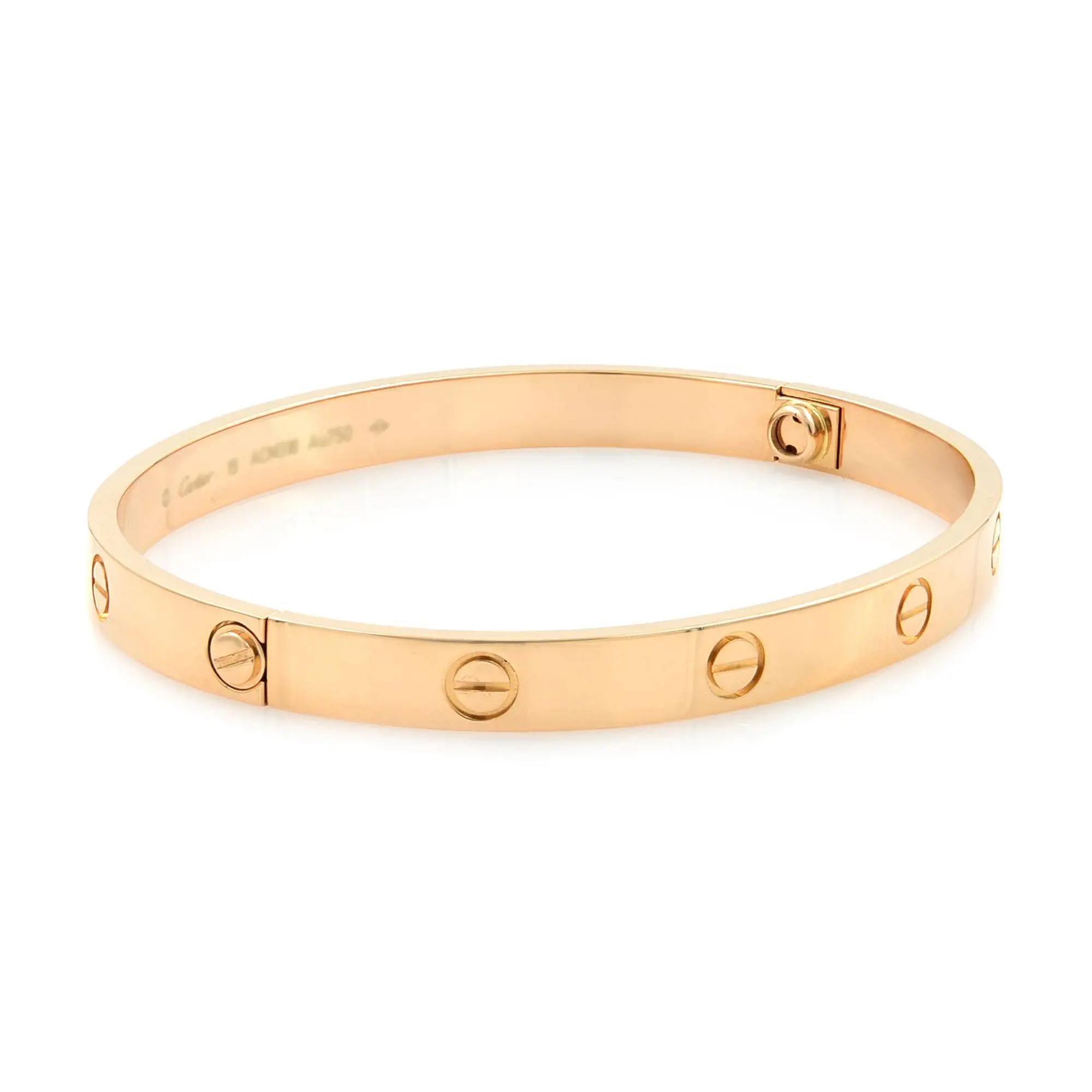 Cartier classic Love bracelet bangle in size 19. Crafted in 18k rose gold. Width: 6.1mm. New style screw system. Excellent pre-owned condition. Looks unworn. Recently got polished. Comes with a screw driver, travel pouch, polishing invoice from