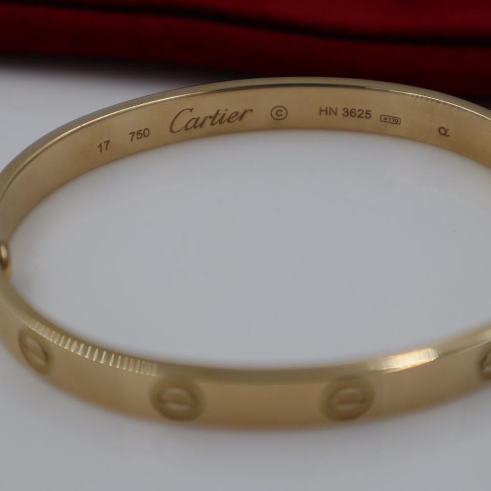 CARTIER 18Kt Yellow Gold Love Bracelet with Original Pouch and Screwdriver. 
Size 17. Weight: 21.3 dwt/ 33.1 grams