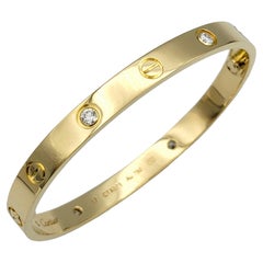 Cartier Love Armreif aus 18 Karat Gelbgold mit 4 runden Diamanten