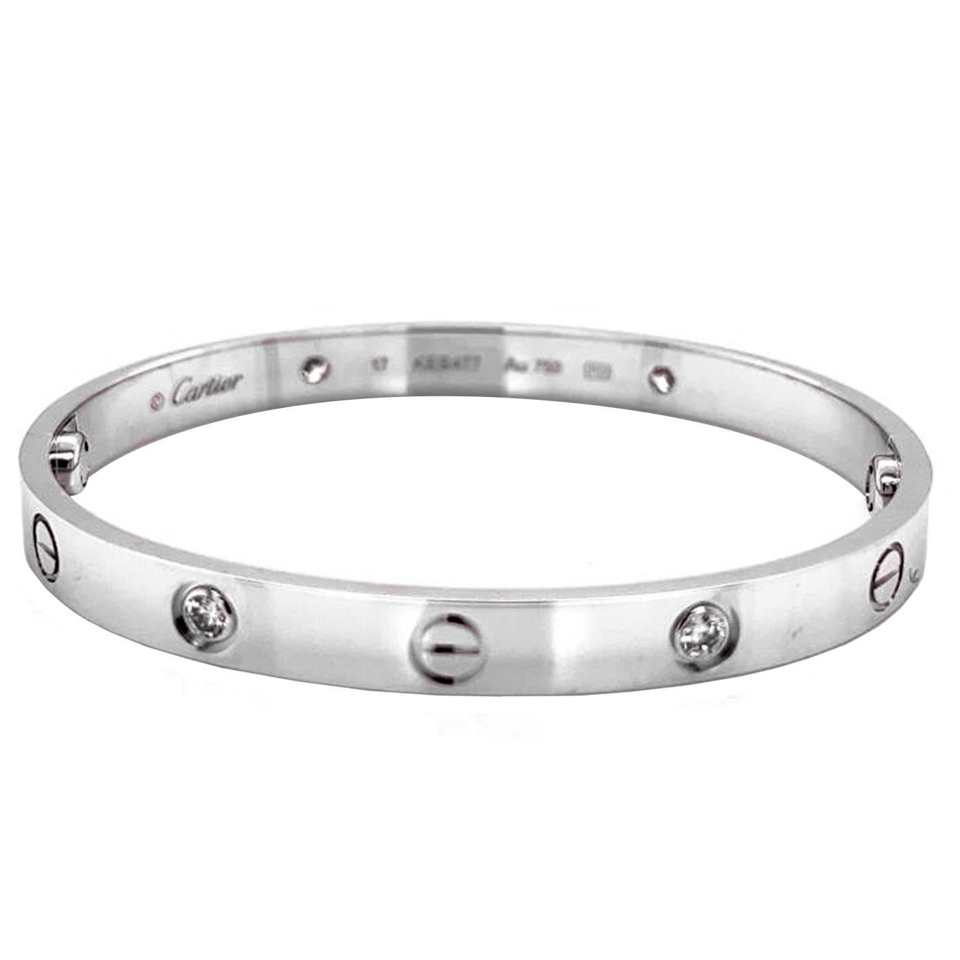 LOVE bracelet, 18K white gold (750/1000), set with 4 diamonds totaling 0.42 carats. Comes with a screwdriver. Width: 6.1 mm. Created in New York in 1969, the LOVE bracelet is an icon of jewelry design: a close-fitting, oval bracelet composed of two