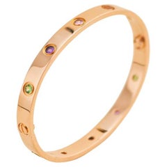 Cartier Bracelet Love 10 en or rose avec plusieurs pierres précieuses taille 17