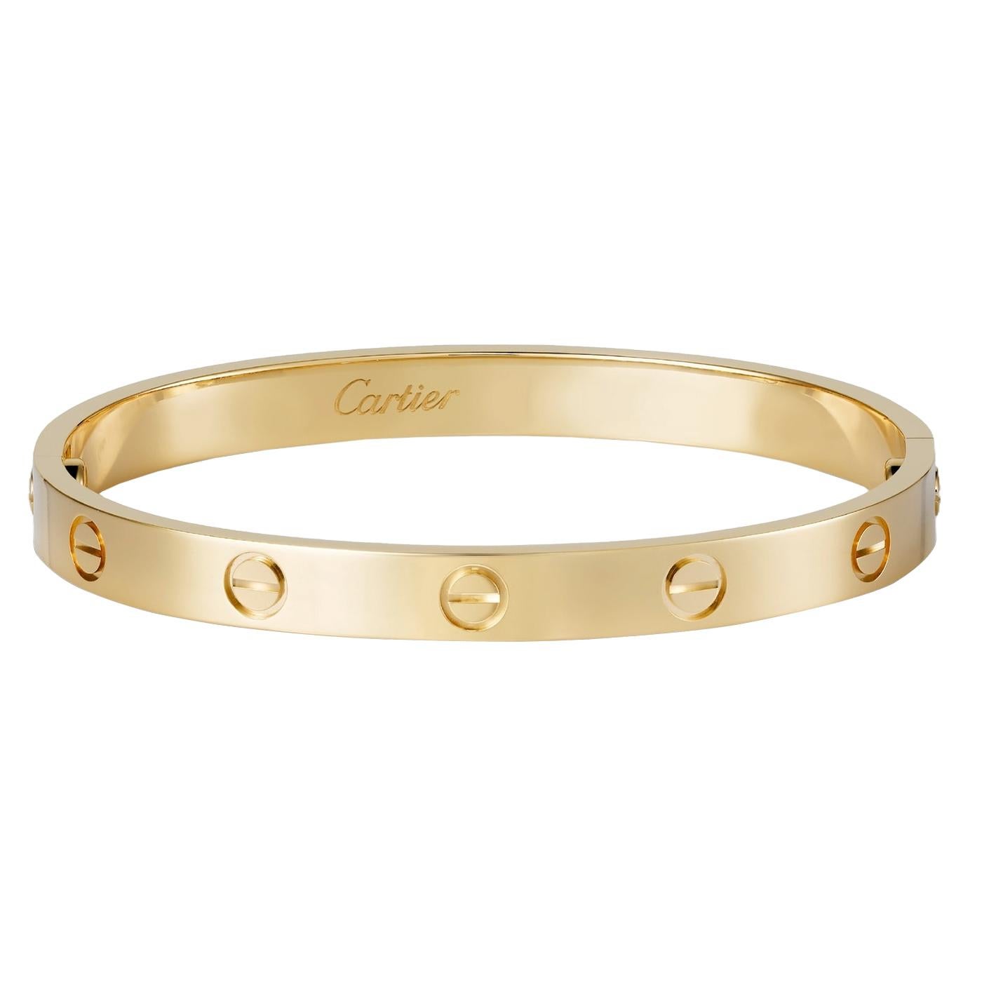 LOVE bracelet, 18K yellow gold (750/1000). Width: 6.1 mm. Created in New York in 1969, the LOVE bracelet is an icon of jewelry design: a close-fitting, oval bracelet composed of two rigid arcs that is worn on the wrist and removed using a specific