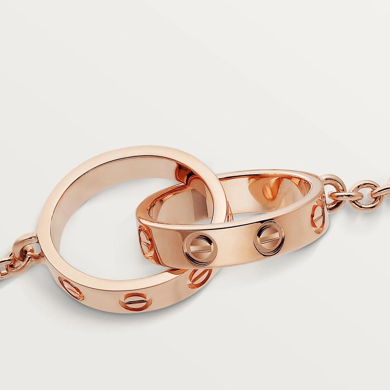 Cartier Love Bracelet, 18 Carat Rose Gold with Two Interlocking Love Rings In Excellent Condition In Vannes, FR