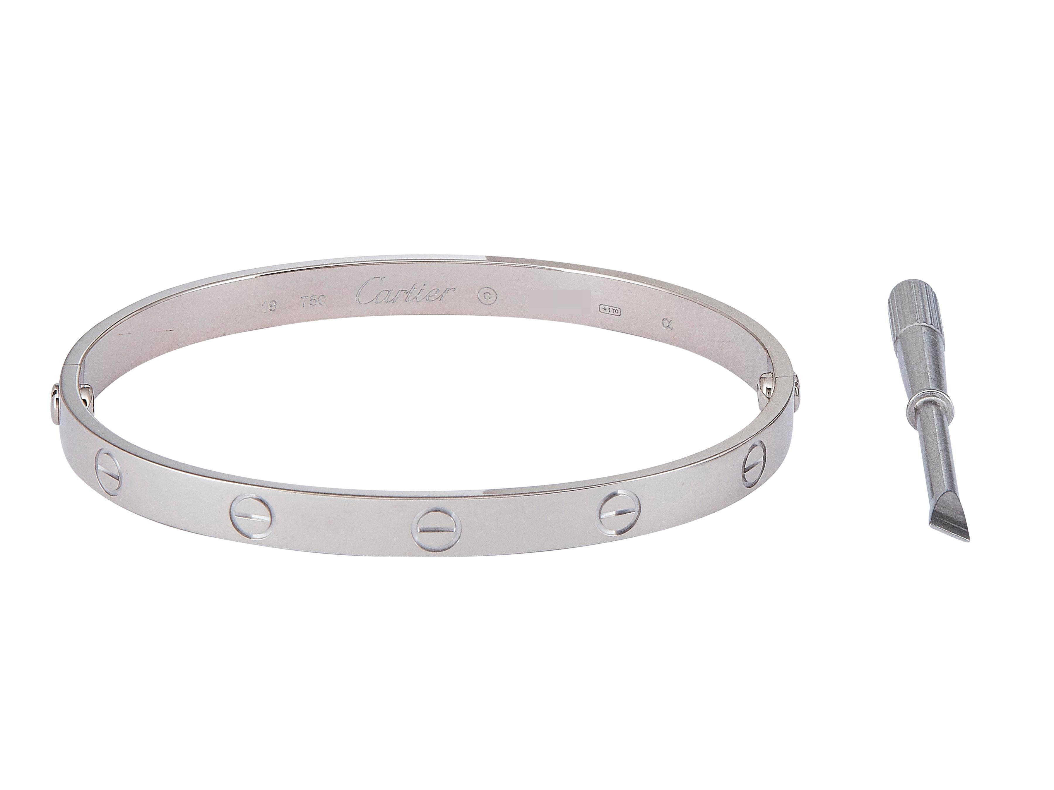The bracelet:
A Cartier Love bracelet in eighteen karat white gold. This Classic model is a size 19.

Accompanied by …
Original box
Service paper

The bracelet is in excellent condition, with only a few minor scratches that are expected with normal