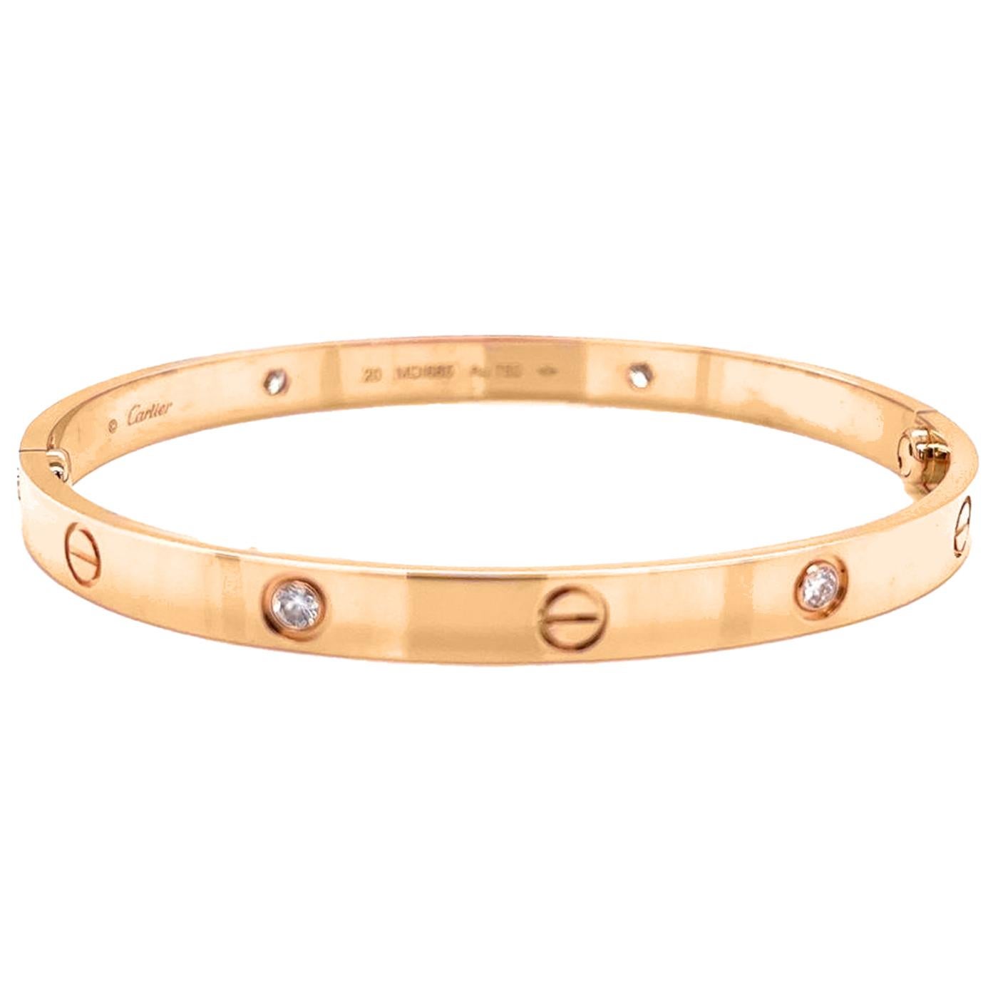LOVE bracelet, 18K yellow gold with 4 brilliant-cut diamonds totaling 0.42 carats. Comes with a screwdriver. Width: 6.1 mm. Created in New York in 1969, the LOVE bracelet is an icon of jewelry design: a close-fitting, oval bracelet composed of two