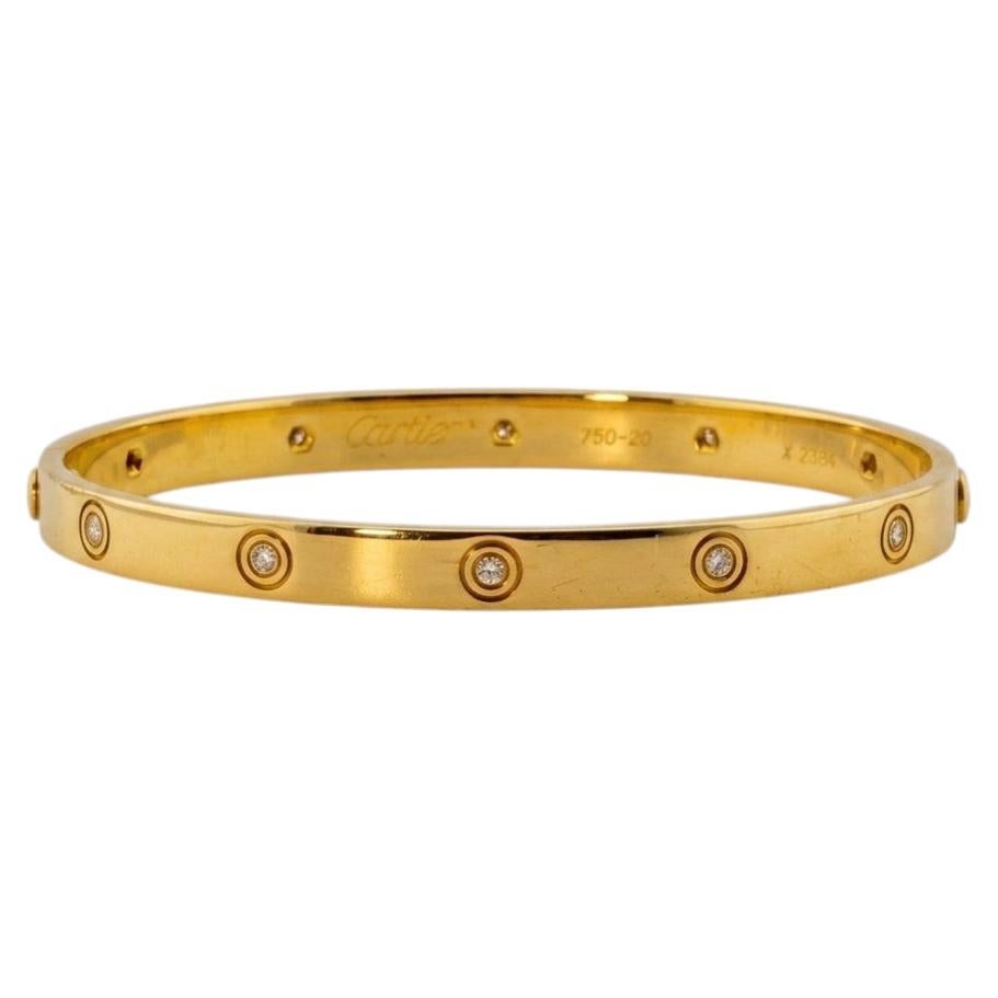 Cartier Love Armband – Armreif aus 18 Karat Gelbgold mit Diamanten