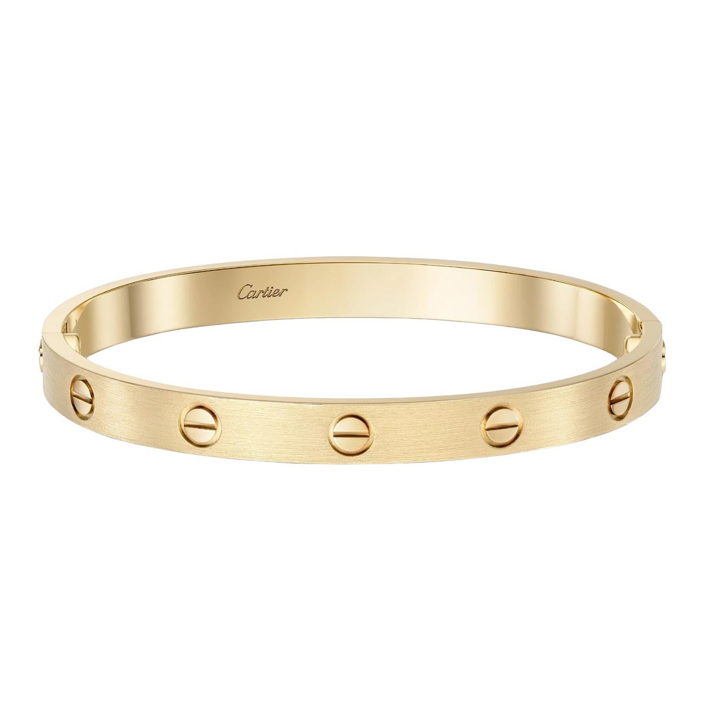 LOVE bracelet, 18K yellow gold (750/1000), brushed finish. Comes with a screwdriver. Width: 6.1 mm. Created in New York in 1969, the LOVE bracelet is a jewelry design icon: a close-fitting, oval bracelet composed of two rigid arcs that is worn on