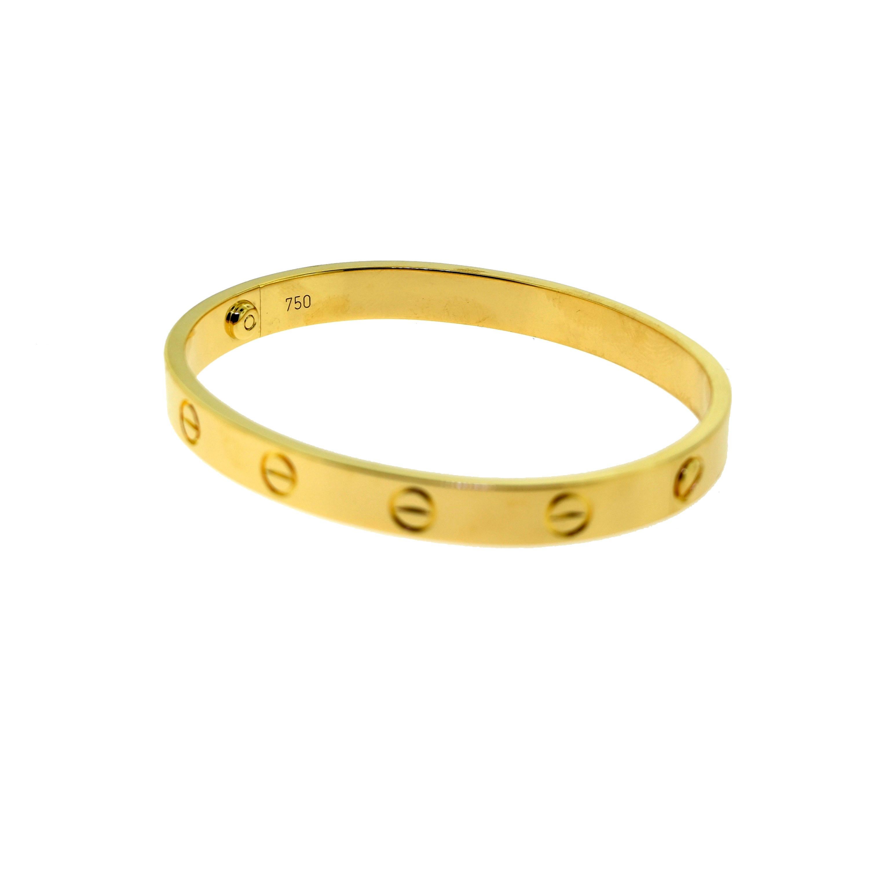 gold bangle with circle and line through it