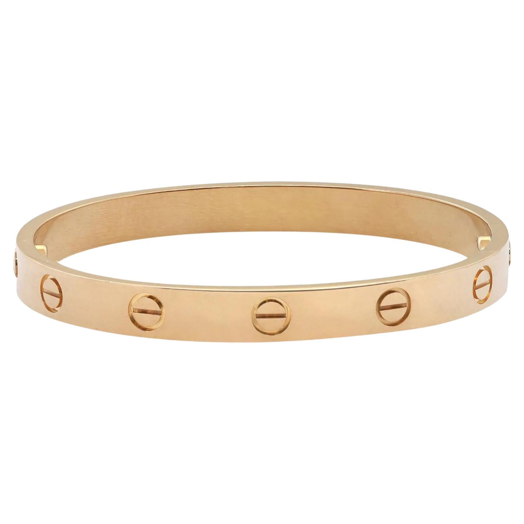 Cartier classic 18K yellow gold Love bangle bracelet. Size 16. Width: 6.1mm. New style screw system. Excellent pre-owned condition. Original box and papers are not included. Comes with a Chronostore appraisal and a presentable gift box. 

