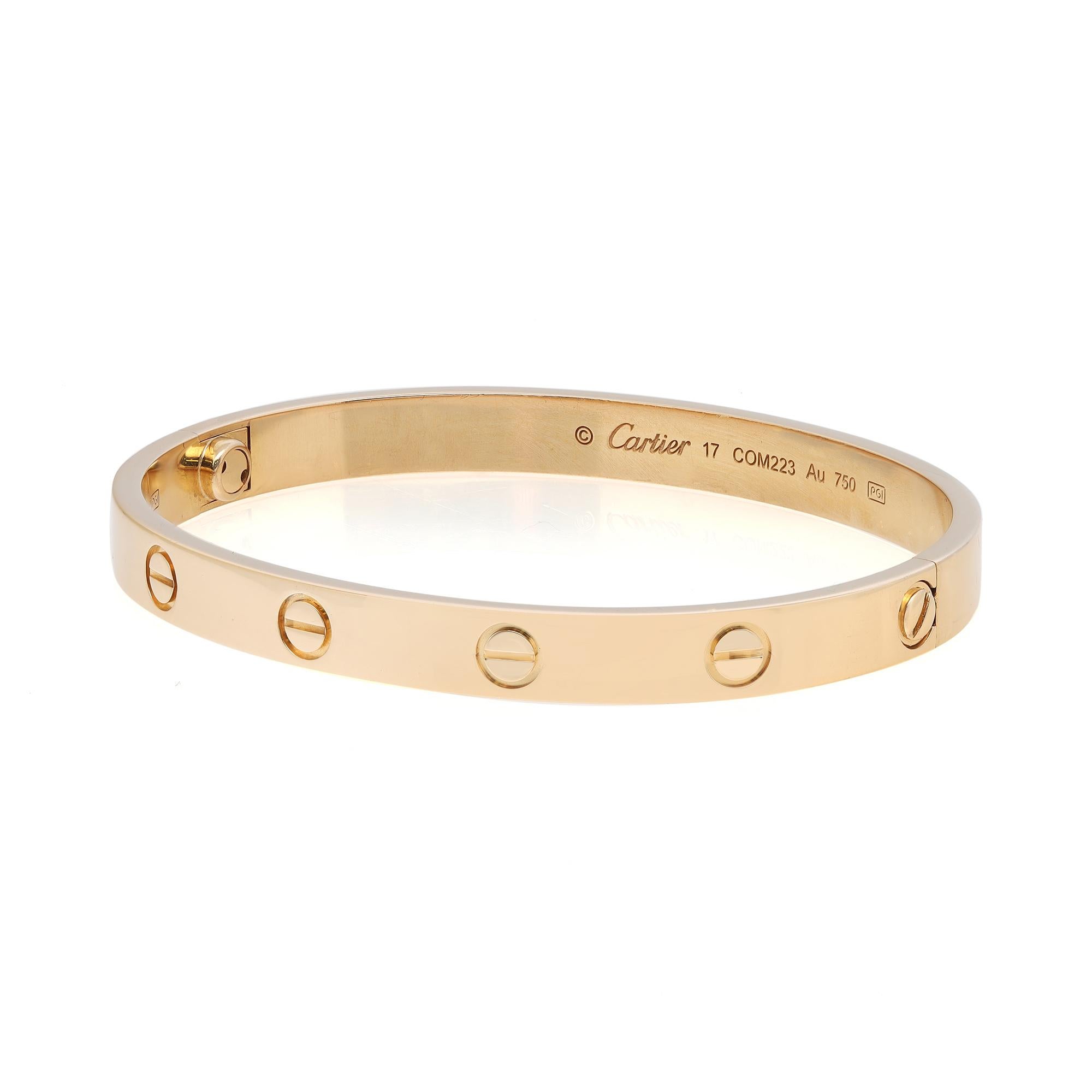 Cartier classic 18K yellow gold Love bangle bracelet size 17. Width: 6.1mm. New style screw system. Excellent pre owned condition. Come with a screwdriver and original box. original papers are not included. Chronostore appraisal included.
