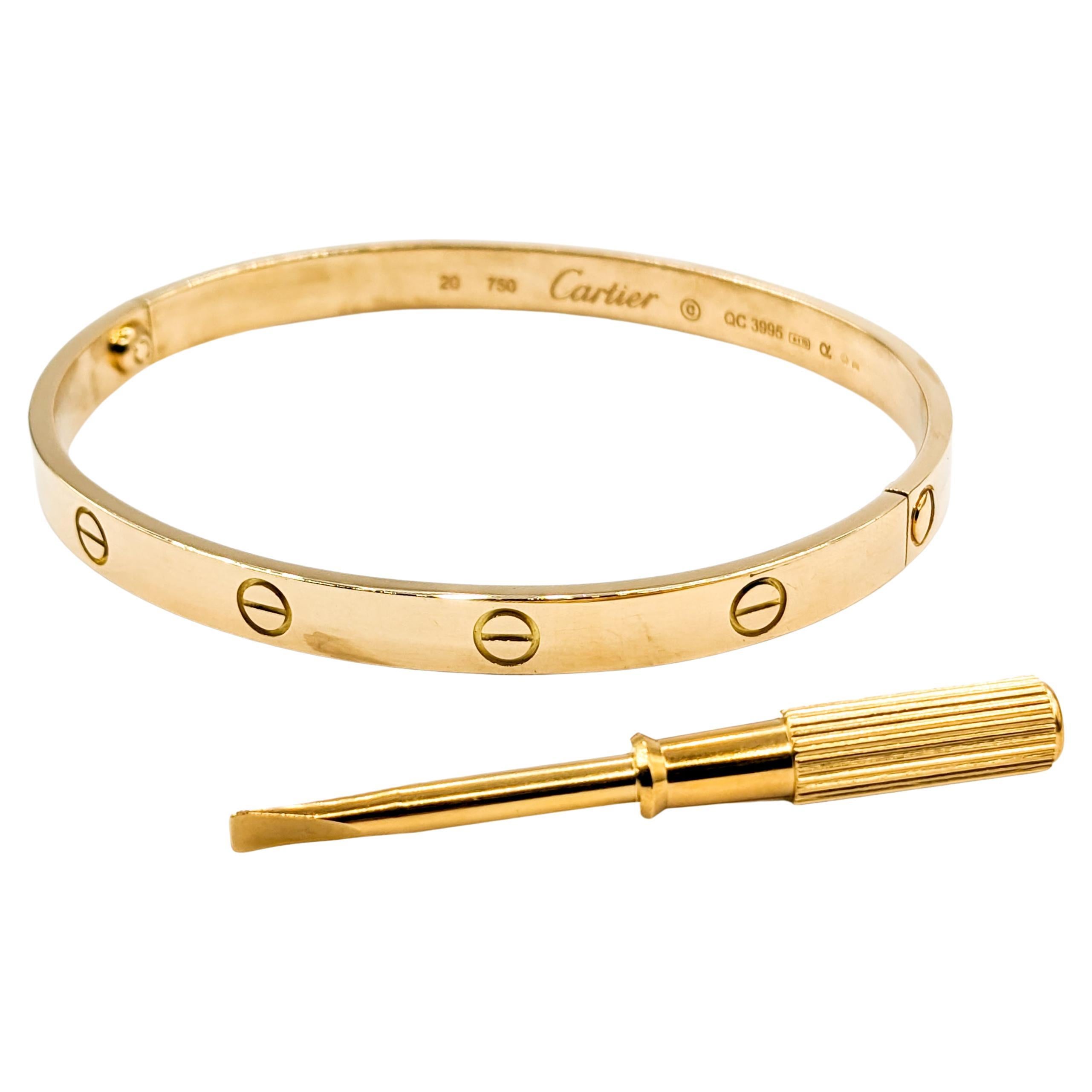 Cartier Love Bracelet 18kt Yellow Gold Size 20

Introducing the iconic Cartier Love bracelet, a testament to both style and romance, finely crafted in radiant 18kt yellow gold. This piece encapsulates timeless elegance, exuding a luminous sheen that