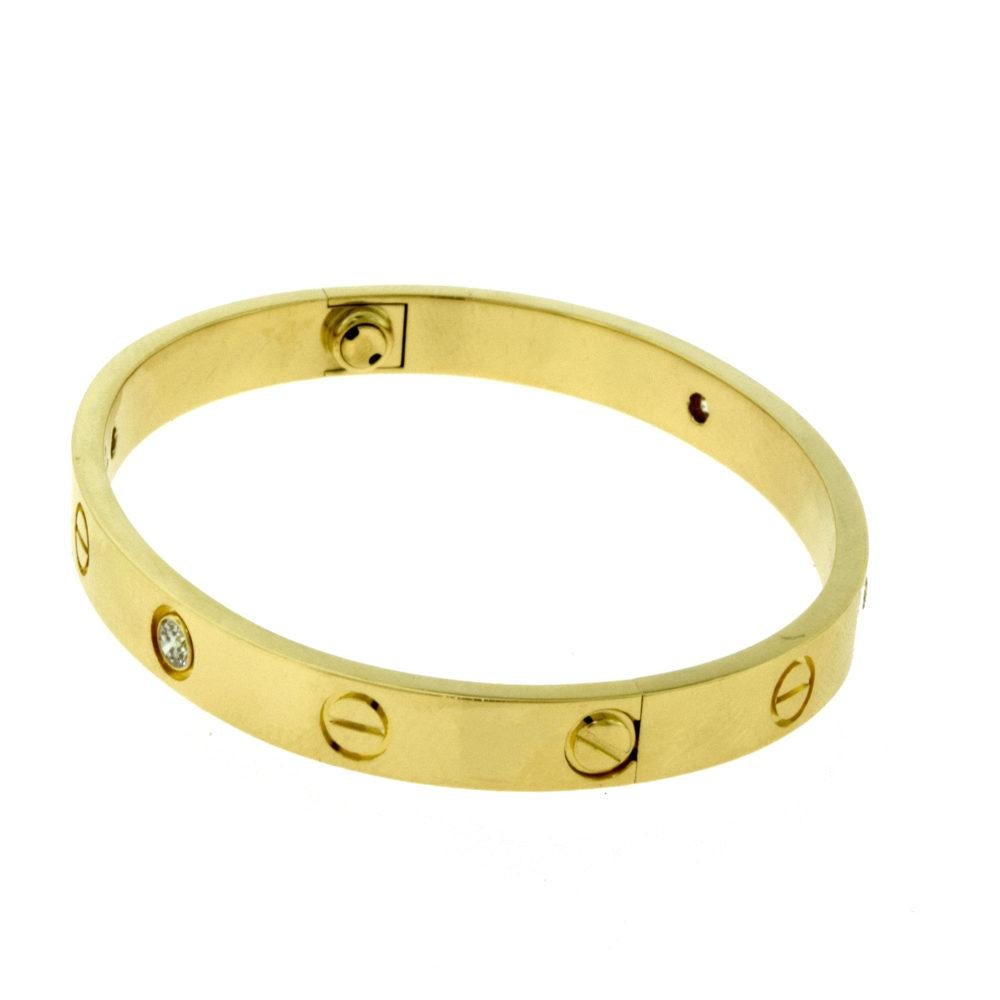 Cartier Love Bracelet 4 Diamond in 18 Karat Yellow Gold In Excellent Condition In Miami, FL