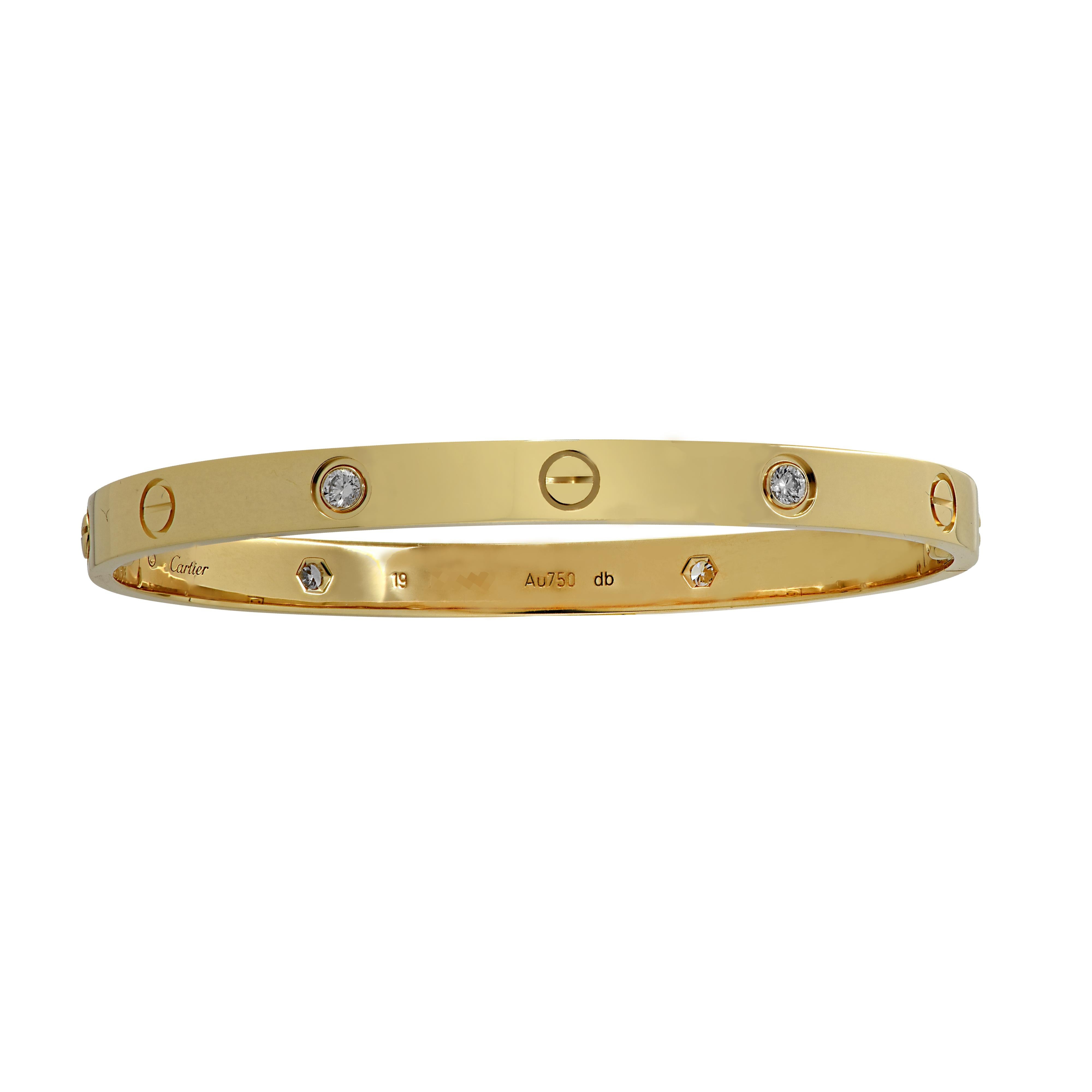 Cartier LOVE bracelet crafted in 18 Karat Yellow Gold, featuring 4 round brilliant cut diamonds weighing approximately .40 carats total. The Cartier love collection is a timeless tribute to the symbol of love that transcends through the decades in