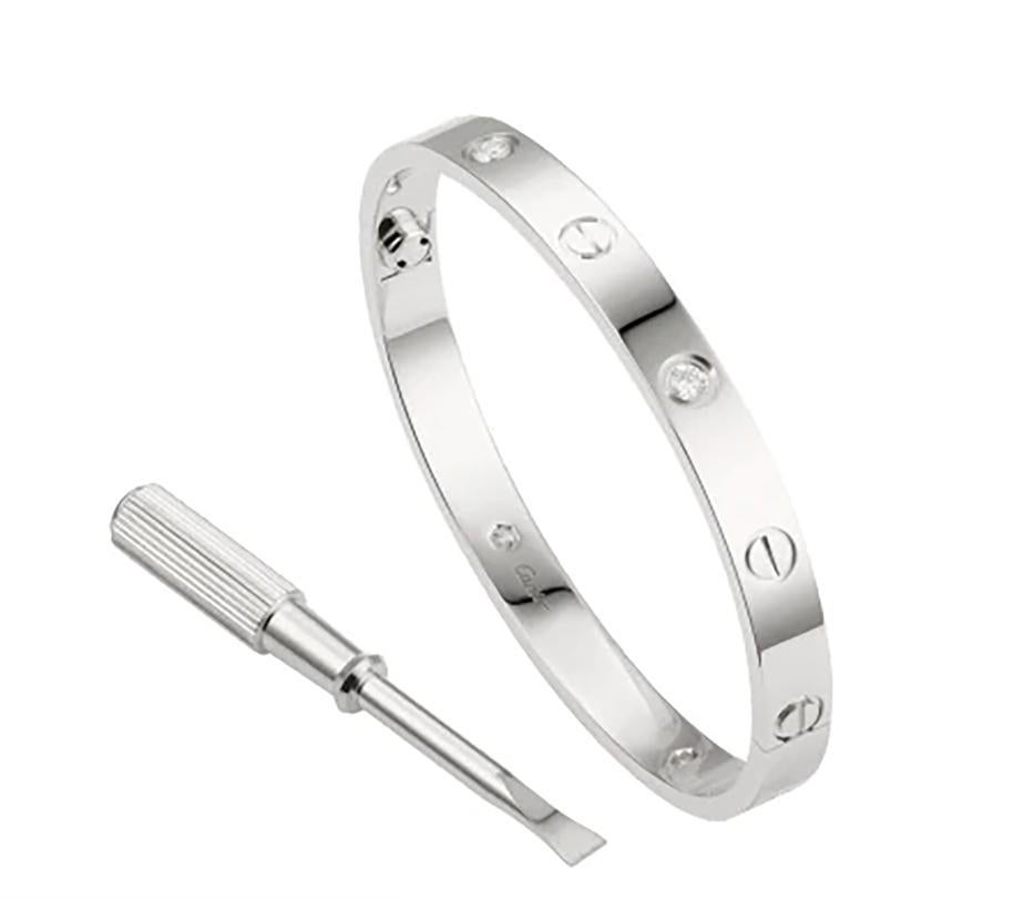 Designer: Cartier

Collection: Love

Style: Bangle Bracelet

Metal: White Gold

Stone: Round Brilliant Cut Diamond

Total Carat Weight: 0.42 ct

​​​​​​​Metal Purity: 18k

Bracelet Size: 20 = 20 cm

Hallmarks: 20, Au750 Cartier, Serial No.,

Retail: