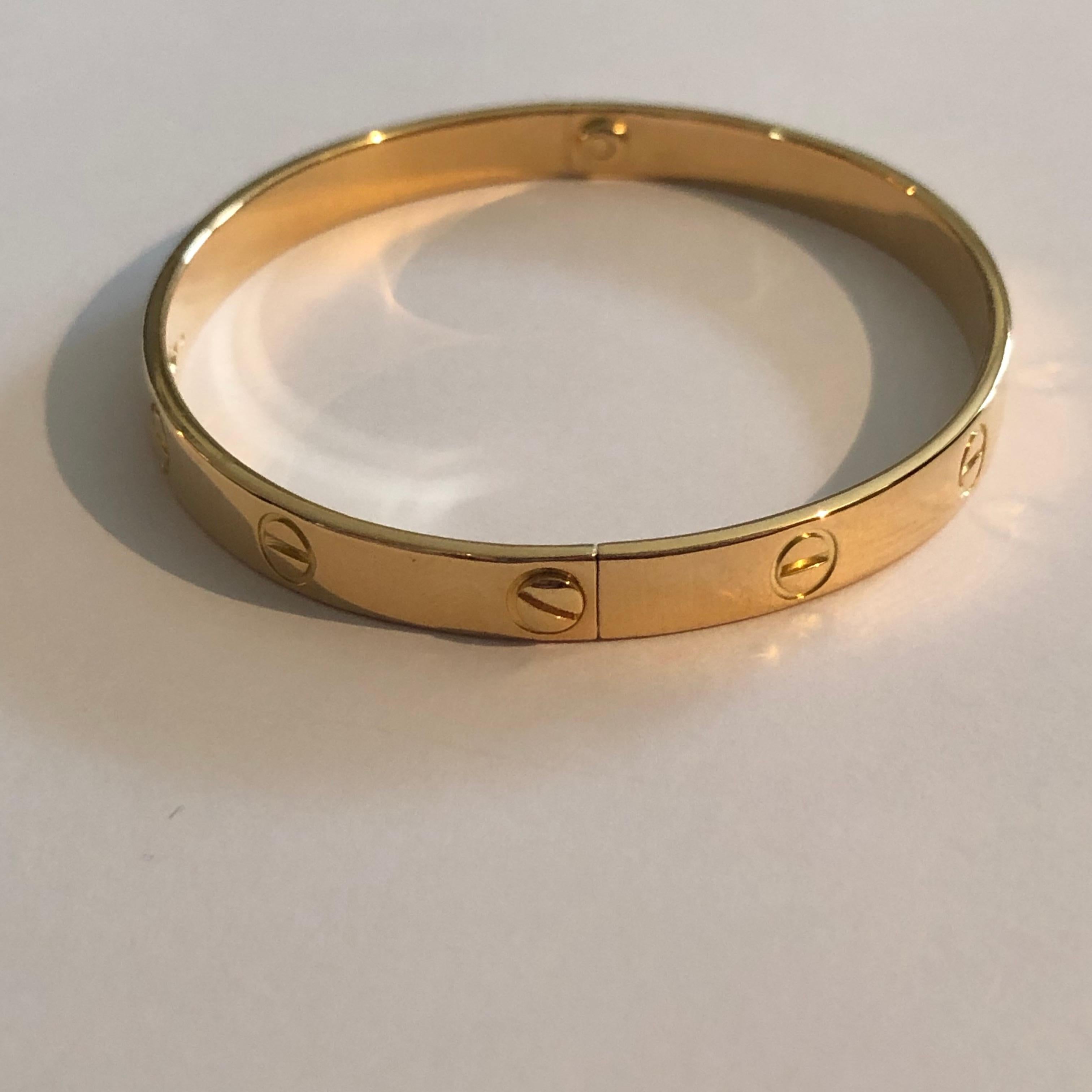Great Love Bracelet by Cartier. 
First version in yellow gold 18K from 1970s. 

AS NEW : bracelet has just been polished and screws are new. 

Size is 20. It is signed and stamped (for gold and Cartier's hand).

Still on sale at Cartier for 6