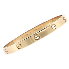 Pulsera Cartier LOVE, modelo clásico, oro amarillo de 18 quilates, talla 19, con caja y documentos