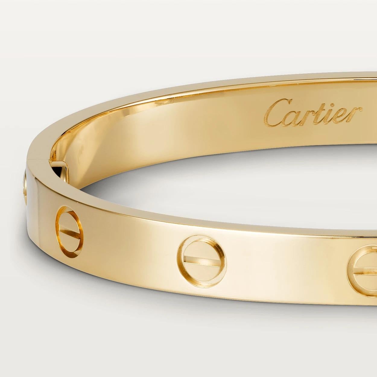 CARTIER LOVE BRACELET
In Yellow Gold in different measures 15 to 18 , this one is 17
If the robust locking mechanism and miniature screw heads that characterized Cartier’s Love bracelet when it first appeared conjured crude, medieval hardware,