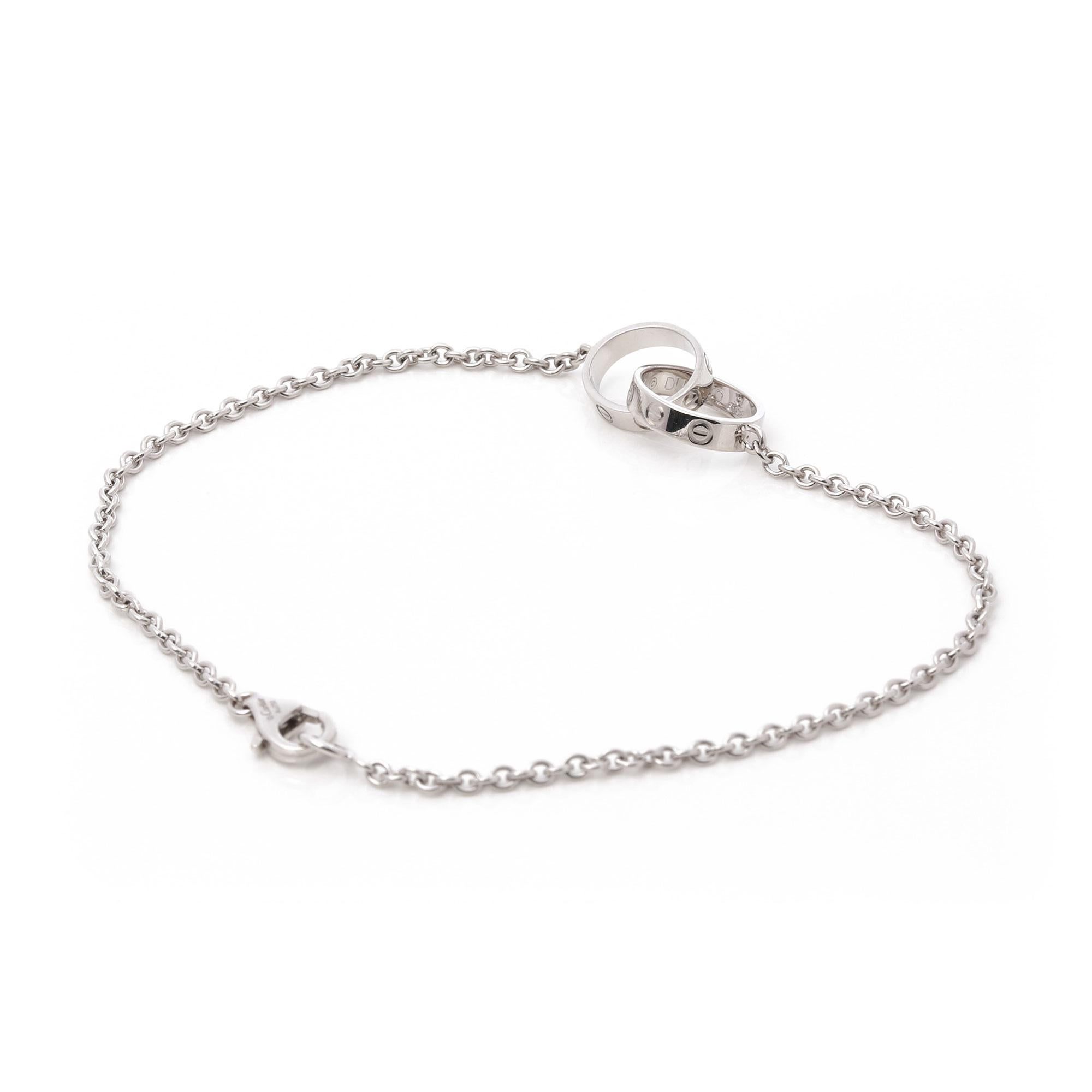 This bracelet by Cartier is from their Love collection and features two interlinking pendants with their iconic screw detailing, set in 18k white gold. Accompanied with a Cartier box. Our Xupes reference is COMJ564 should you need to quote this. 