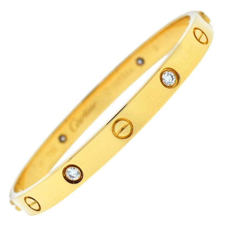 C-415

Designer: Cartier

Collection: Love

Style: Bangle Bracelet

Metal: White Gold

Metal Purity: 18k

Bracelet Size: 18 = 18 cm

Stones: 6 Round Brilliant Cut Diamonds

Hallmarks: 18, Au750 Cartier, Serial No.,

Screw System: 