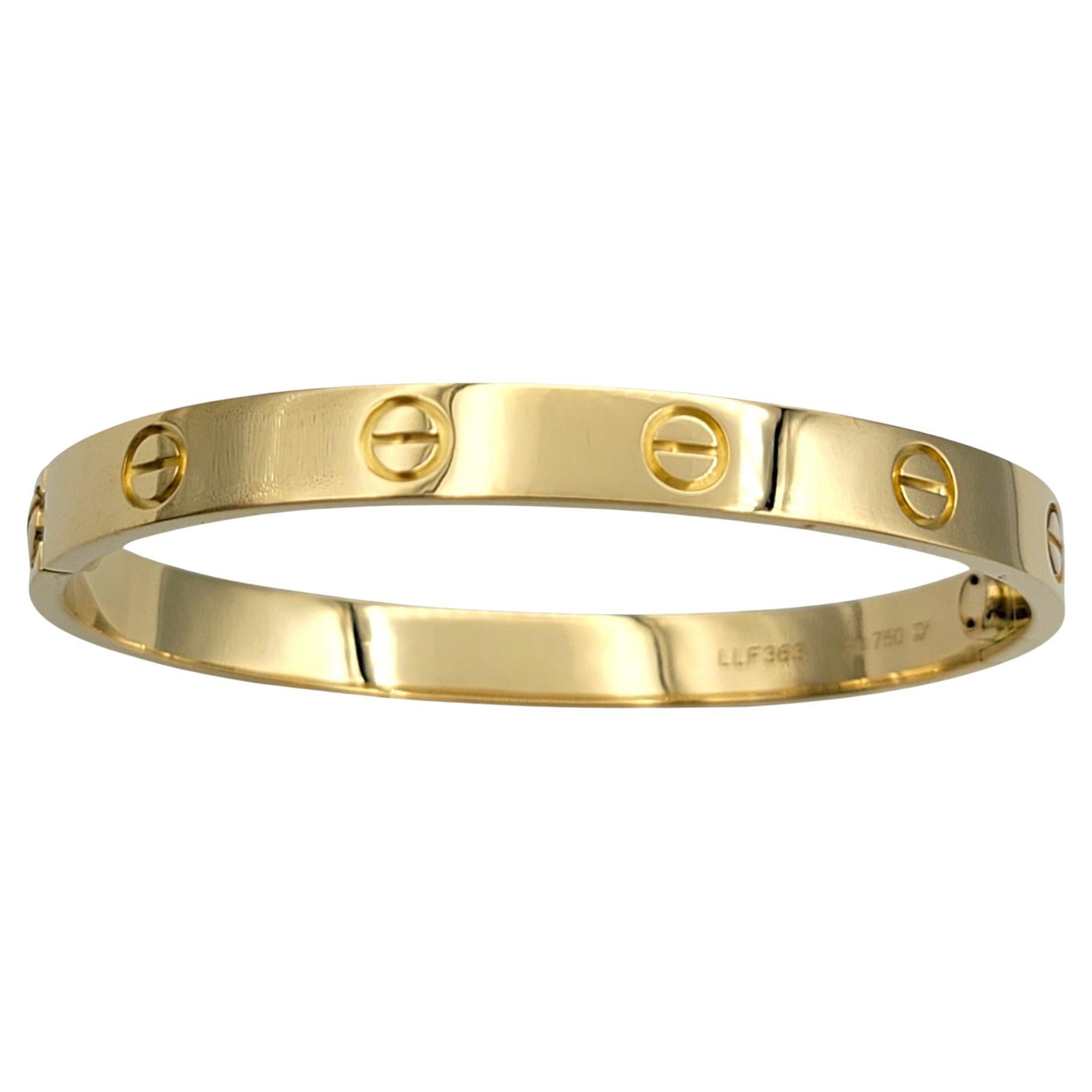 Experience the epitome of timeless elegance with the Cartier Love Bracelet in 18 karat yellow gold, a piece that has transcended the boundaries of jewelry to become a true icon of luxury. Designed in 1969 by Aldo Cipullo, the Love Bracelet is a