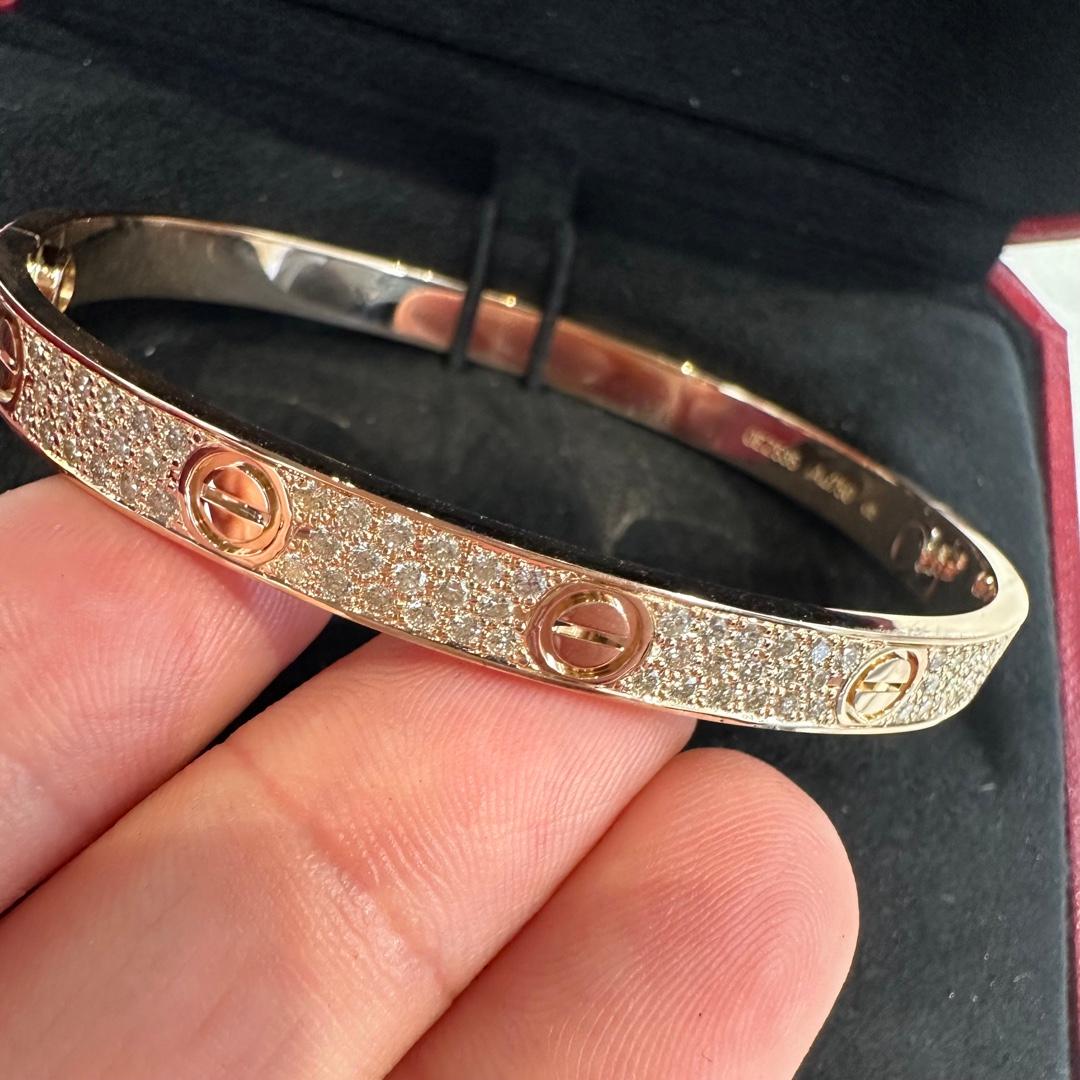 Designer: Cartier

Collection:  Love

Style: Bangle

Metal: Rose Gold

Metal Purity: 18K 

Stones: Brilliant Cut Diamonds set AFTERMARKET

Screw Style System: New style screw (stays put)

Bracelet Size: 19cm

Hallmarks: Cartier; Serial #, 750,