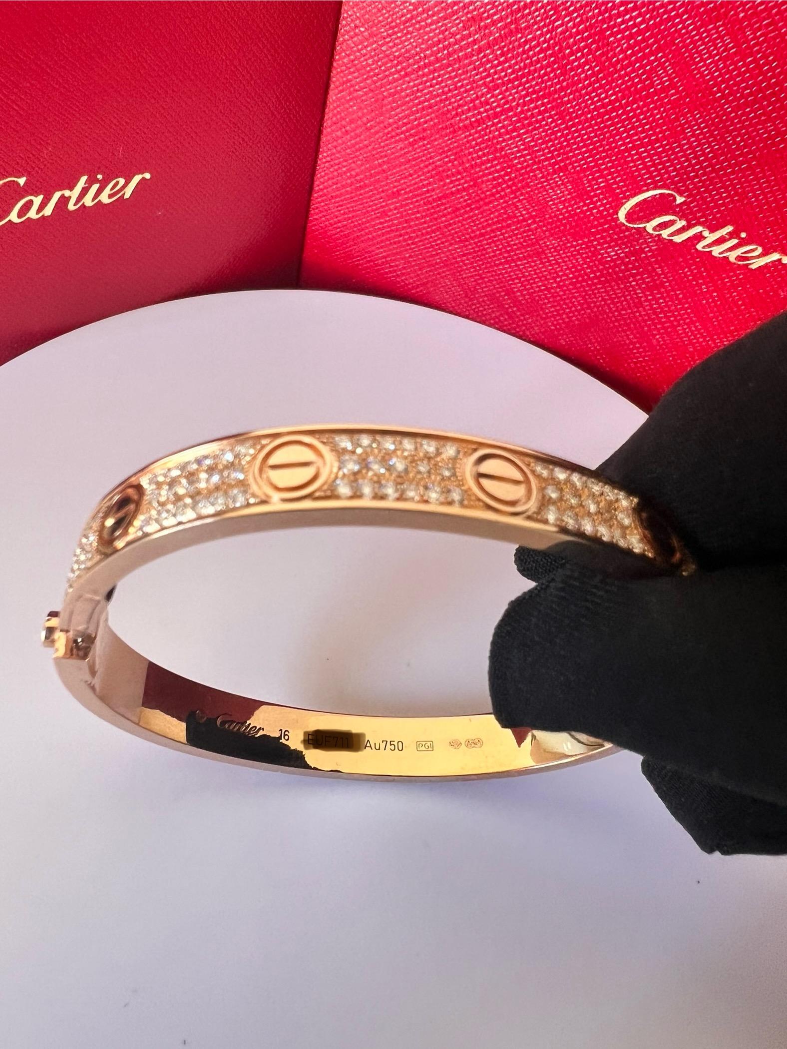 CARTIER LOVE BRACELET
Cartier 'Love' bangle bracelet crafted in 18 karat rose gold with gold screw tops and pave set round brilliant cut diamonds (D-F in color, VVS clarity)
Signed Cartier,  750, with serial number and hallmarks 
The bracelet is