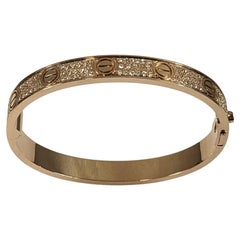 Used Cartier LOVE Bracelet in 18k rose gold with pavé of diamonds box and papers