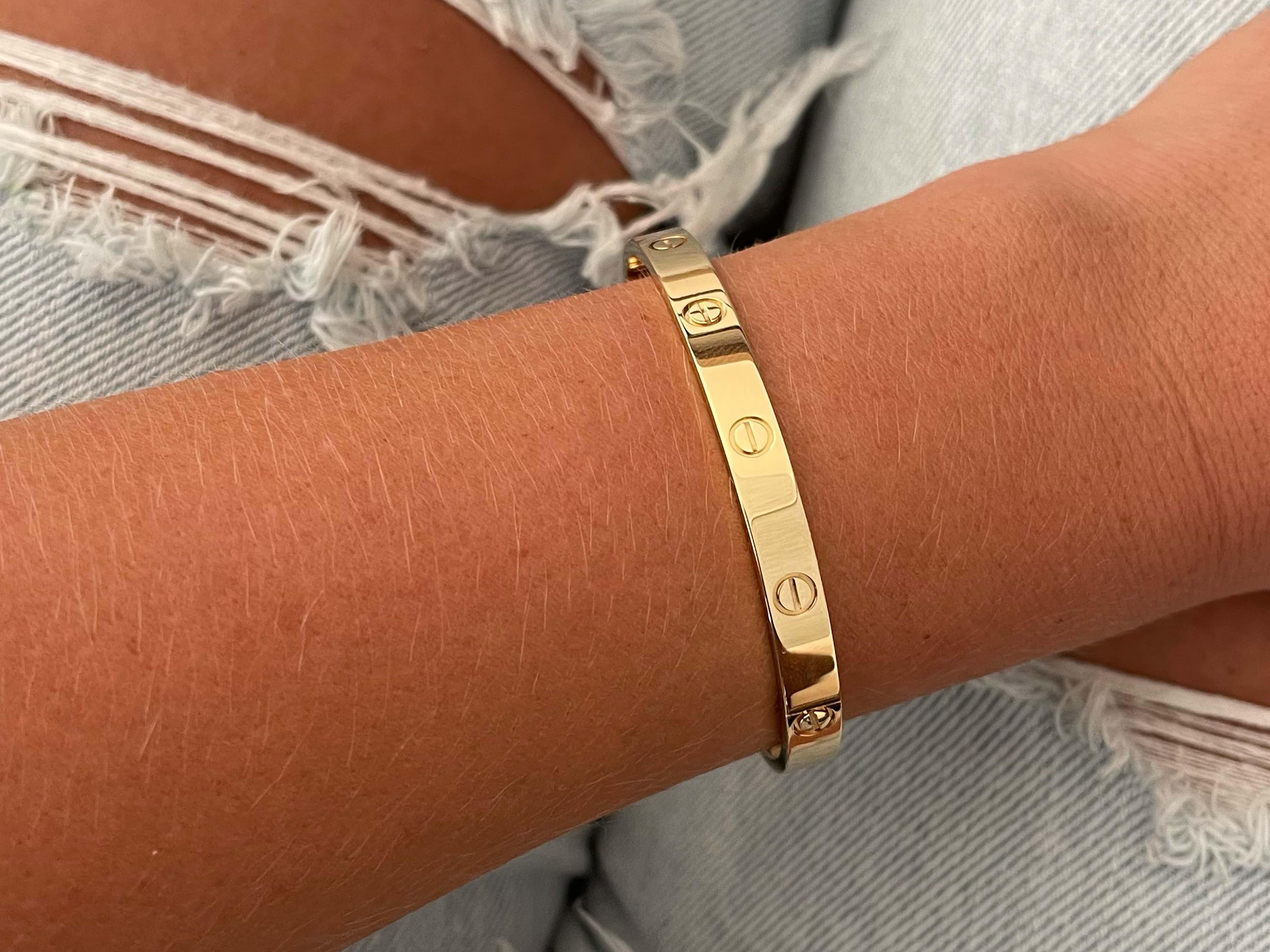 LOVE bracelet, 18K yellow gold (750/1000). Comes with a screwdriver. Width: 6.1 mm. Created in New York in 1969, the LOVE bracelet is an icon of jewelry design: a close fitting, oval bracelet composed of two rigid arcs which is worn on the wrist and