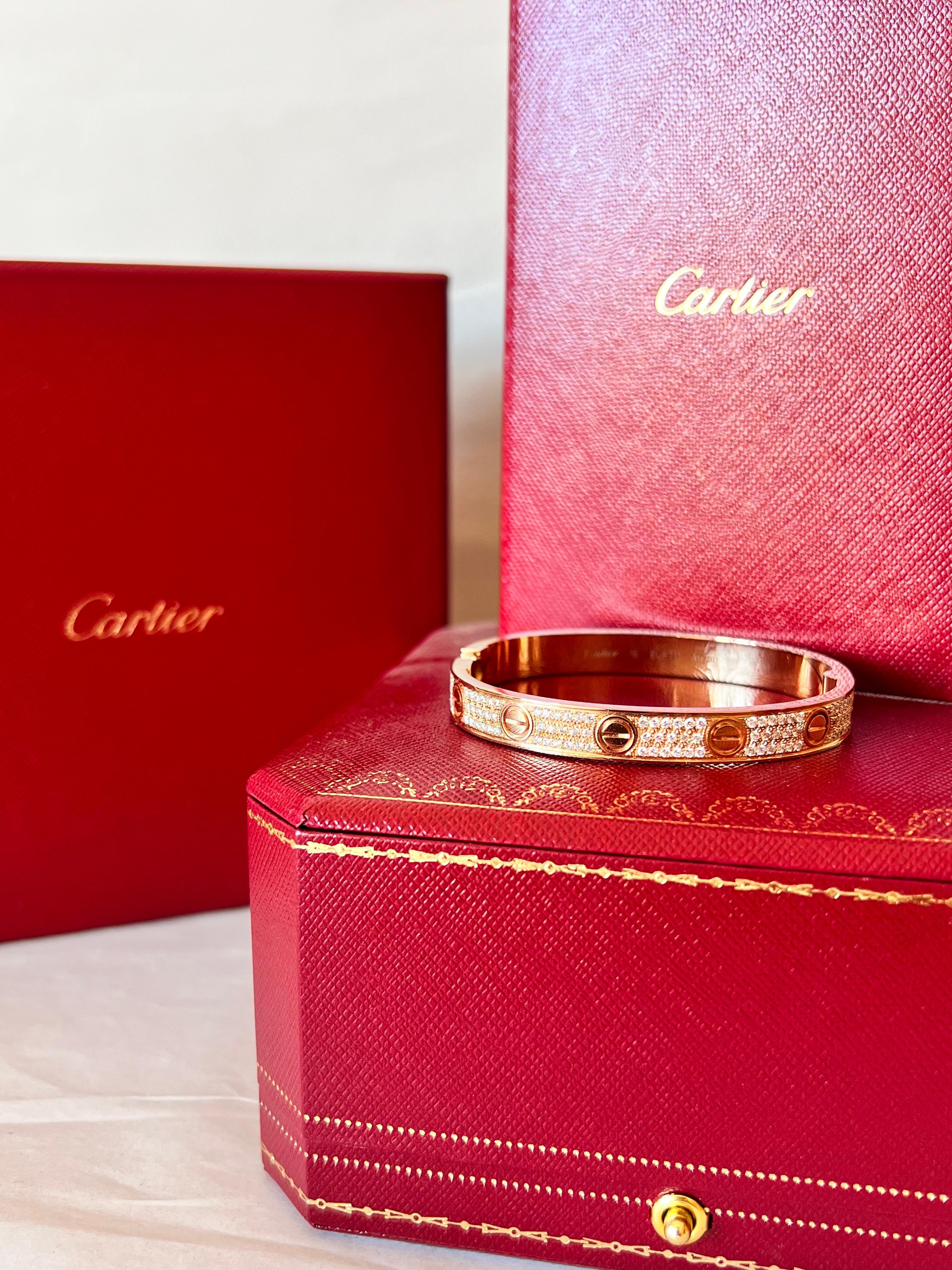 Contemporary Cartier LOVE Bracelet in 18k yellow gold with pavé of diamonds box and papers For Sale