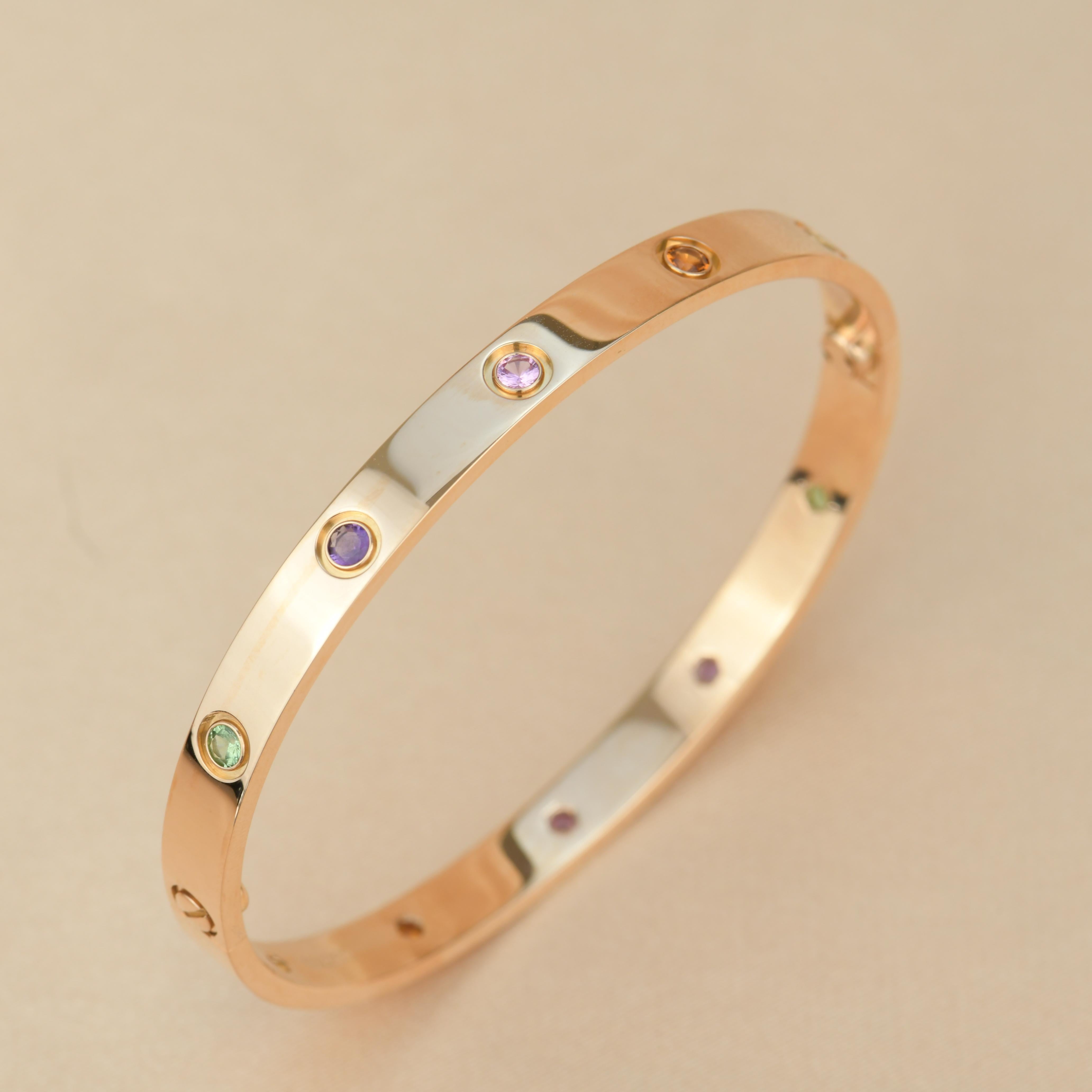 LOVE bracelet, 18K rose gold, set with 2 pink sapphires, 2 yellow sapphires, 2 green garnets, 2 orange garnets, and 2 amethysts. 
Comes with Cartier Box / Authentic card. Size 19
__________________________________

Dandelion Antiques Code