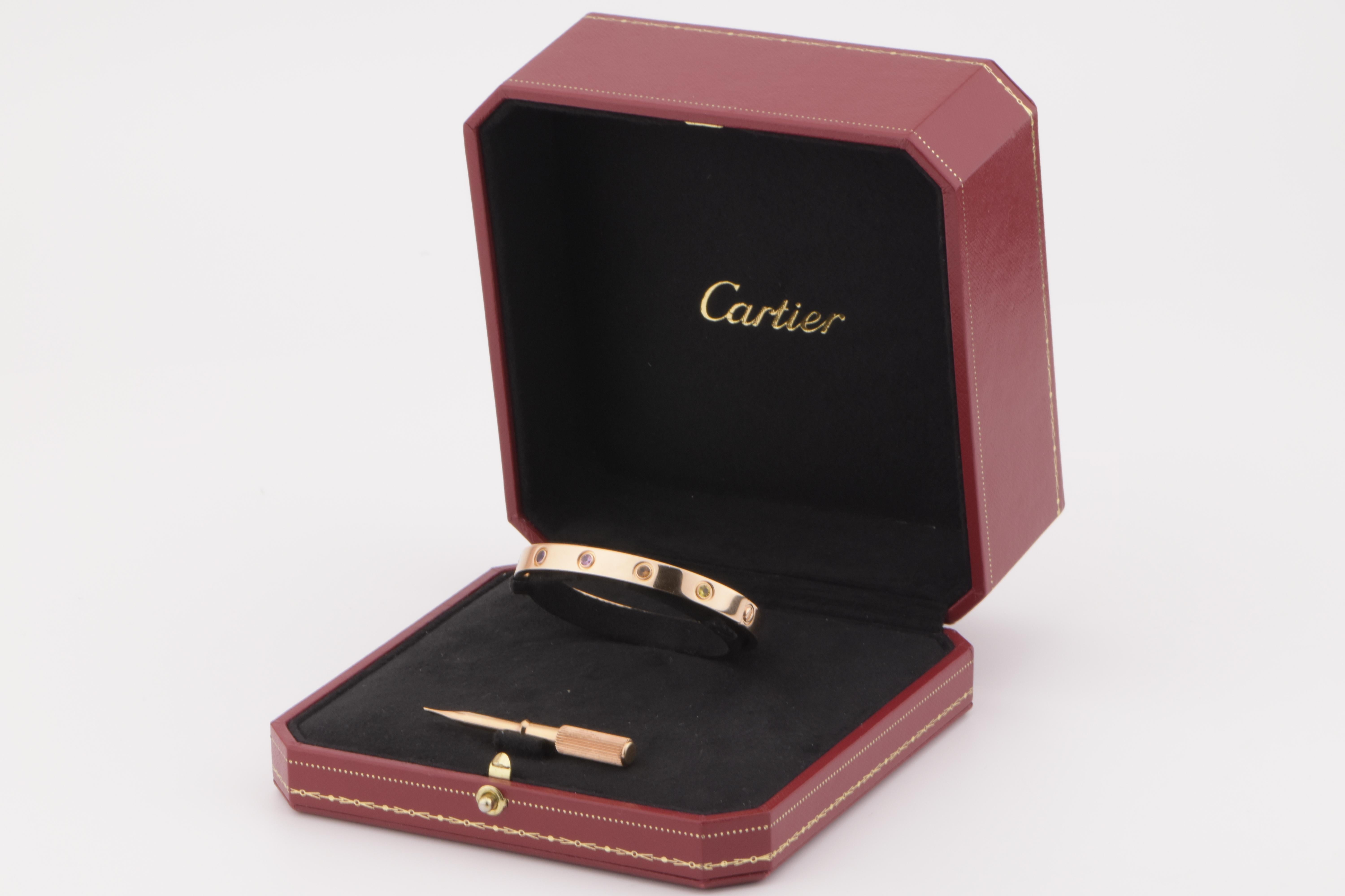 LOVE bracelet, 18K rose gold, set with 2 pink sapphires, 2 yellow sapphires, 2 green garnets, 2 orange garnets, and 2 amethysts. 
________________________________________________

Dandelion Antiques Code: AT-0946
Brand: Cartier
Model: B6036500
Date: