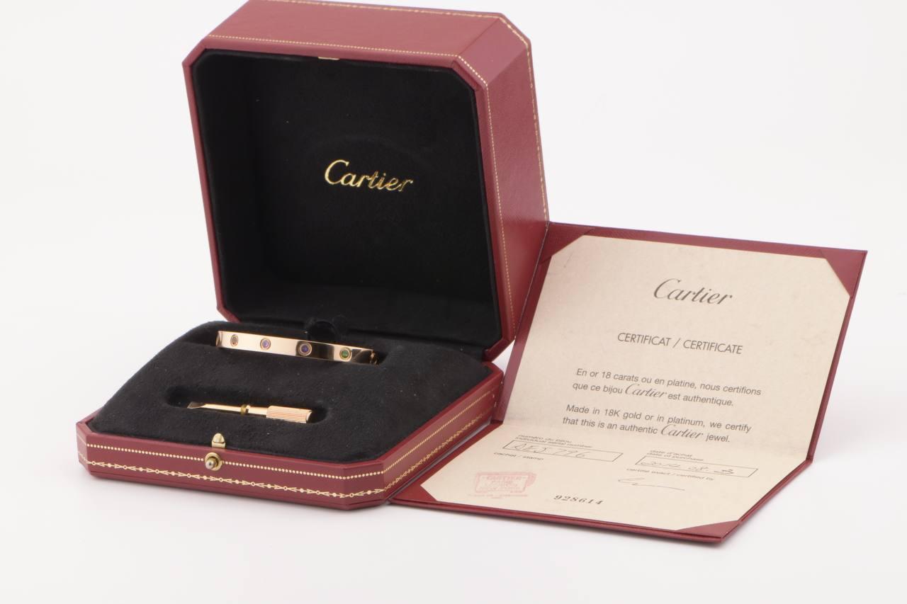LOVE bracelet, 18K rose gold, set with 2 pink sapphires, 2 yellow sapphires, 2 green garnets, 2 orange garnets, and 2 amethysts. 
Comes with Screwdriver/ Cartier Box / Authentic card.  Size 17
__________________________________

Dandelion Antiques