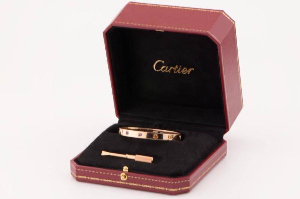 LOVE bracelet, 18K rose gold, set with 2 pink sapphires, 2 yellow sapphires, 2 green garnets, 2 orange garnets, and 2 amethysts. 
_____________________________________________________________
Dandelion Antiques Code: AT-0992A
Brand:  Cartier
Model: 