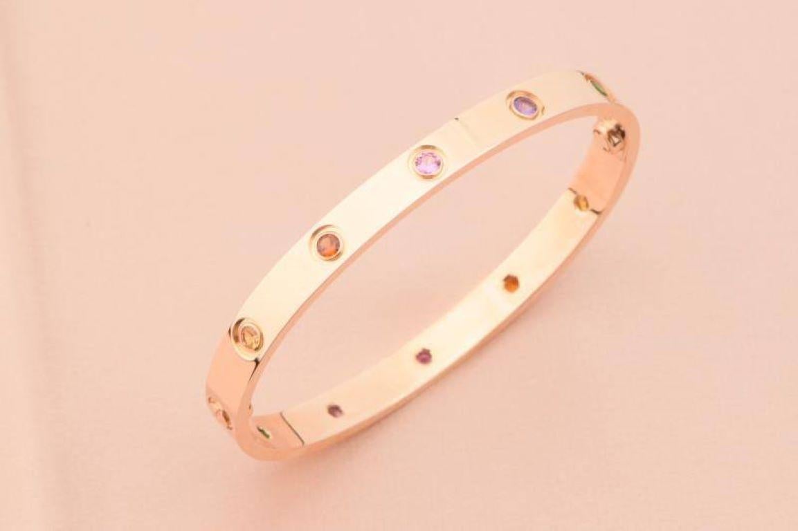 LOVE bracelet, 18K rose gold, set with 2 pink sapphires, 2 yellow sapphires, 2 green garnets, 2 orange garnets, and 2 amethysts. 
_____________________________________________________________
Dandelion Antiques Code: AT-0993
Brand: Cartier
Model: