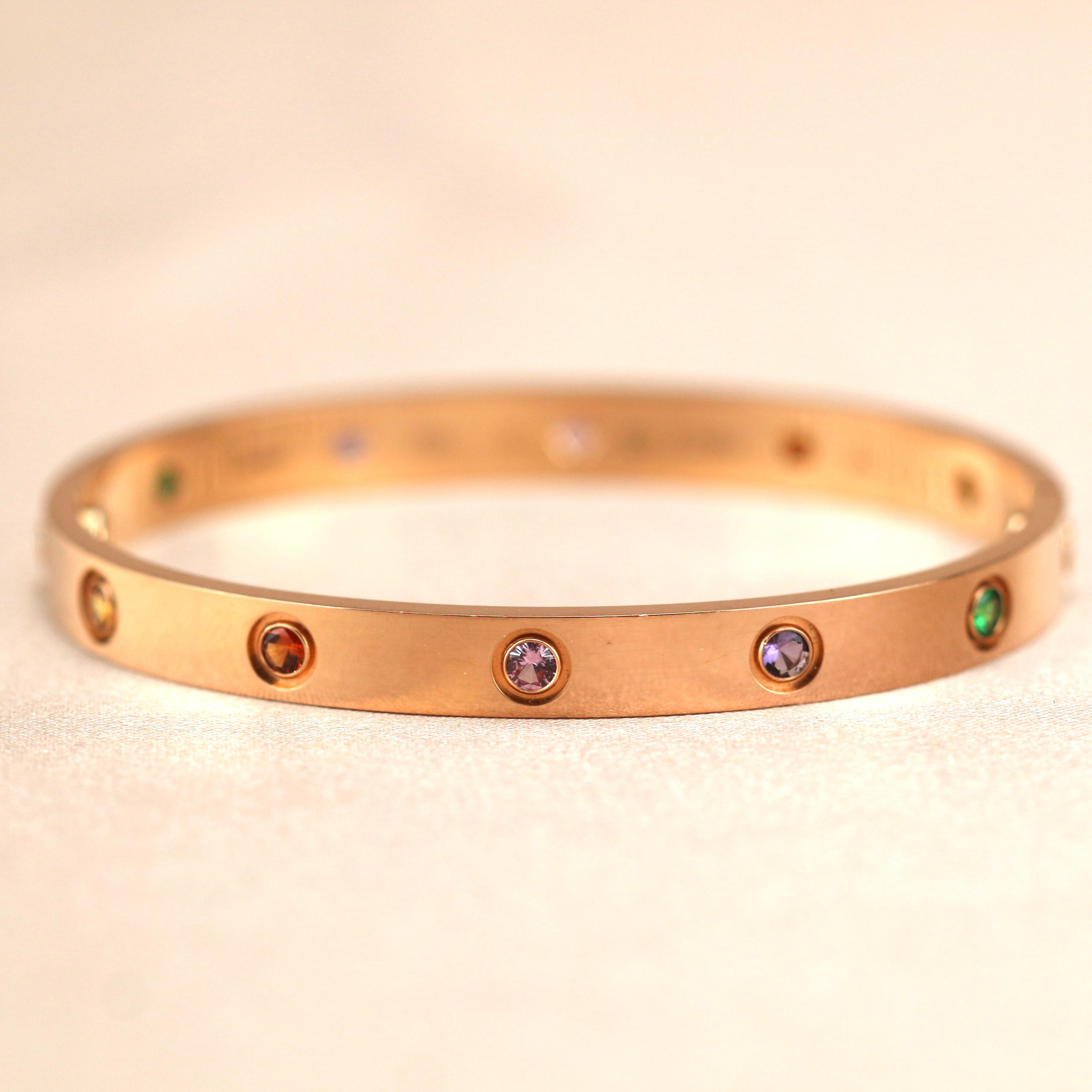 LOVE bracelet, 18K rose gold, set with 2 pink sapphires, 2 yellow sapphires, 2 green garnets, 2 orange garnets, and 2 amethysts. 
_____________________________________________________________
Dandelion Antiques Code AT-1199
Brand Cartier
Model