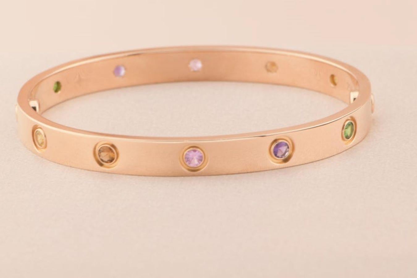 LOVE bracelet, 18K rose gold, set with 2 pink sapphires, 2 yellow sapphires, 2 green garnets, 2 orange garnets, and 2 amethysts. 
_____________________________________________________________
Dandelion Antiques Code AT-1293
Brand Cartier
Model
