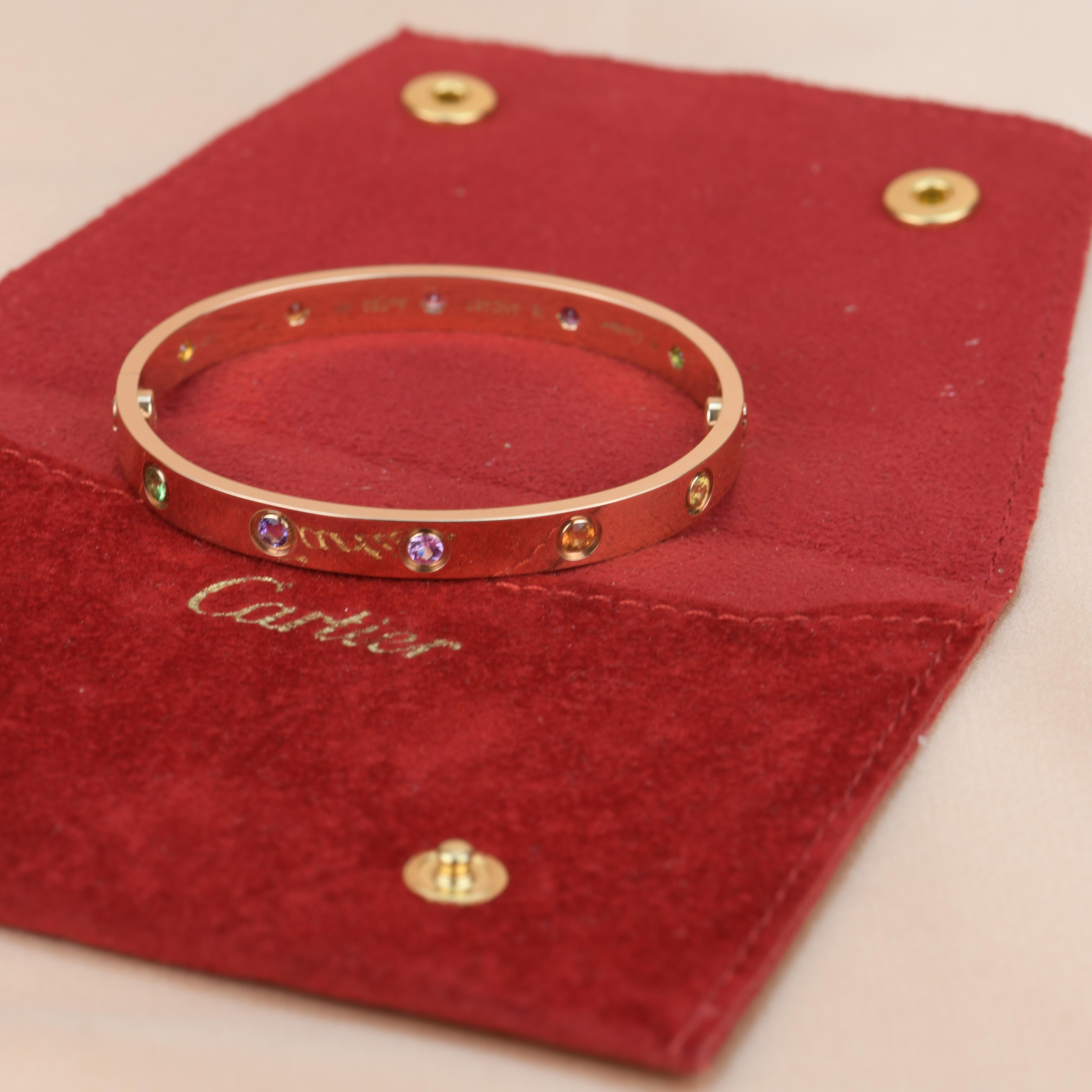 LOVE bracelet, 18K rose gold, set with 2 pink sapphires, 2 yellow sapphires, 2 green garnets, 2 orange garnets, and 2 amethysts. 
_____________________________________________________________
Dandelion Antiques Code AT-1293
Brand Cartier
Model